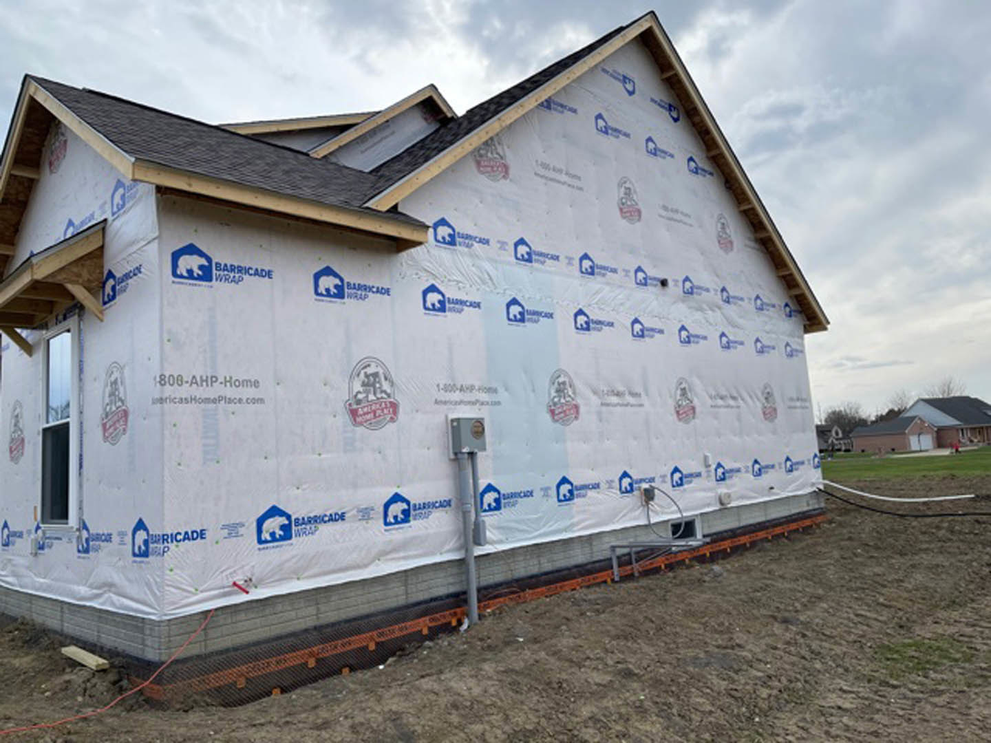 A house with white sheets covering the side of it.