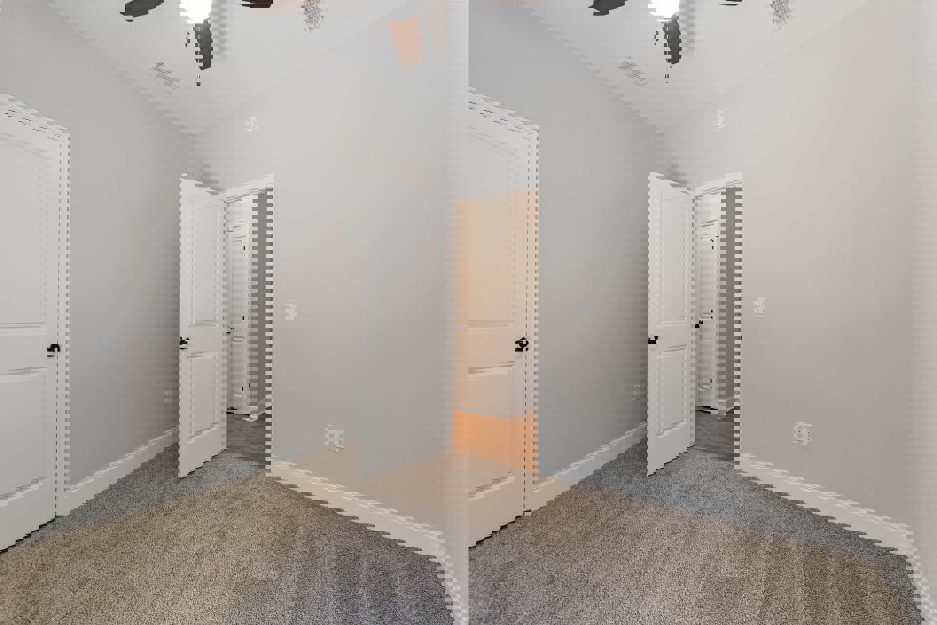 Carpeted room with white paneled doors featuring black knobs, ceiling fan with light, white walls, and crown molding