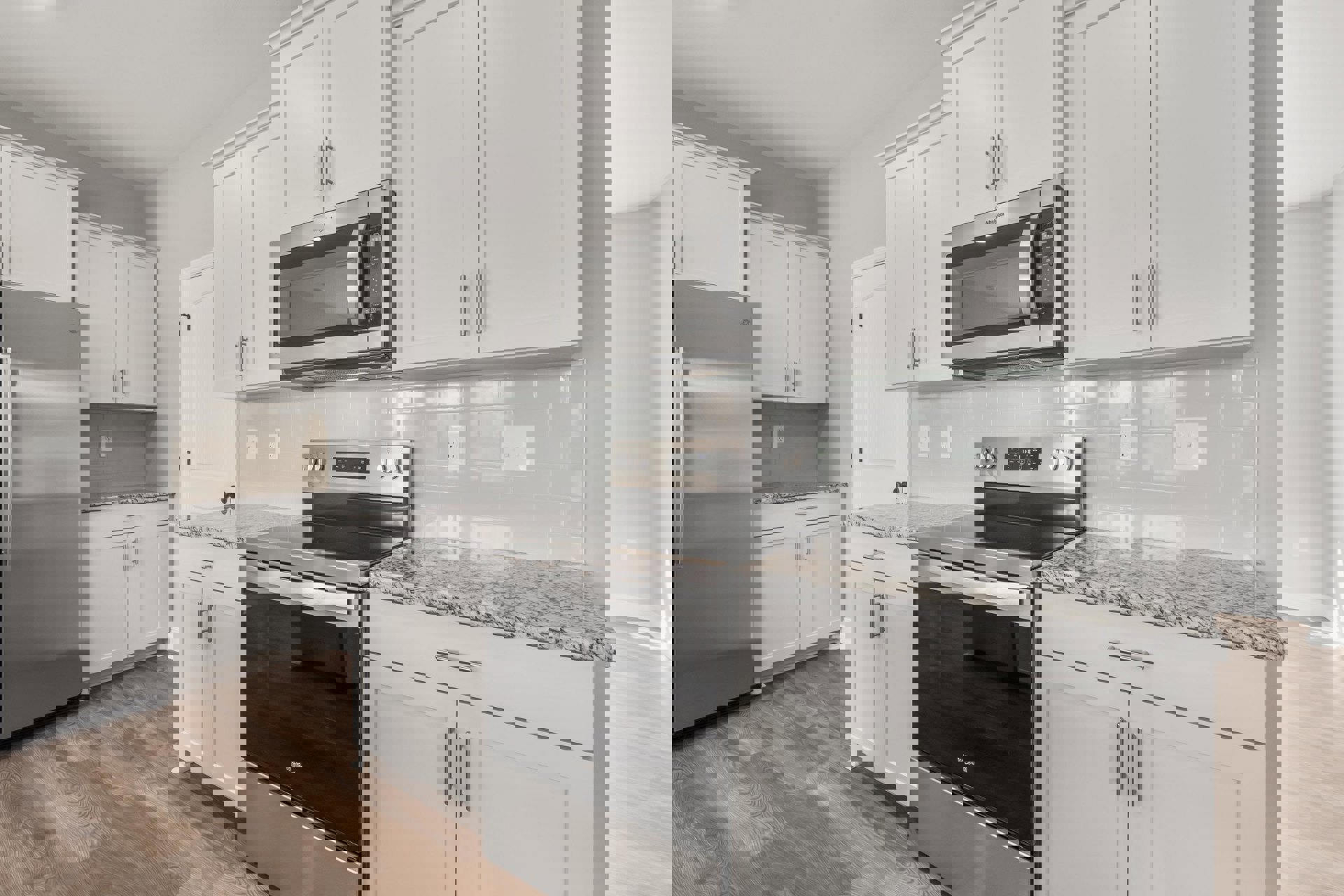 White shaker cabinets, stainless steel stove and microwave, quartz countertops, light tile flooring, and a built-in refrigerator in a modern kitchen.