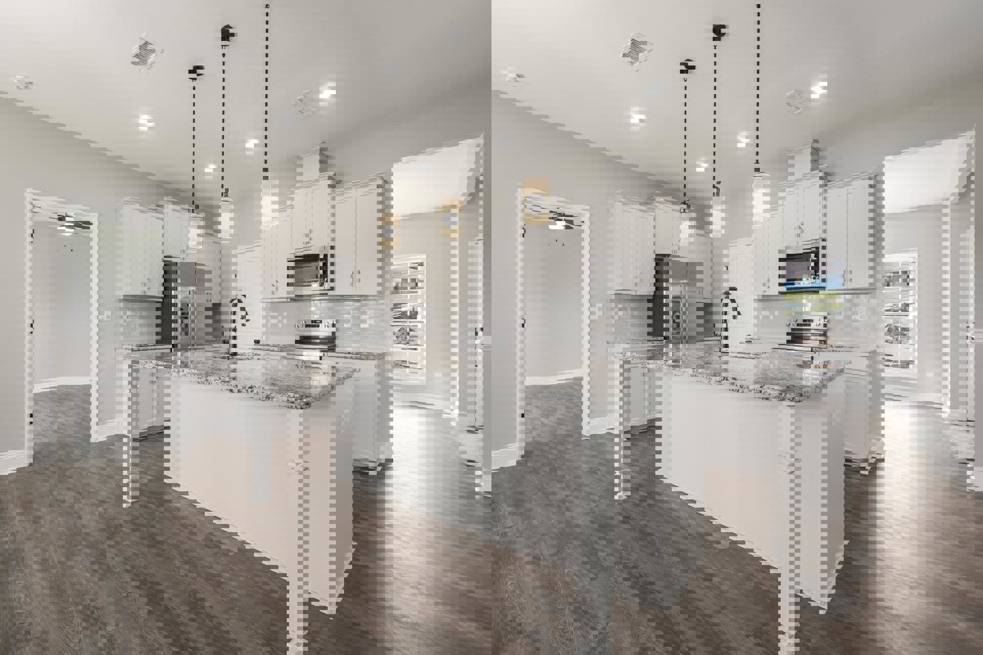 Marble island with waterfall edge, white cabinetry, stainless steel refrigerator, open microwave, wall sconce, light wood flooring, undermount sink, and black accent pole