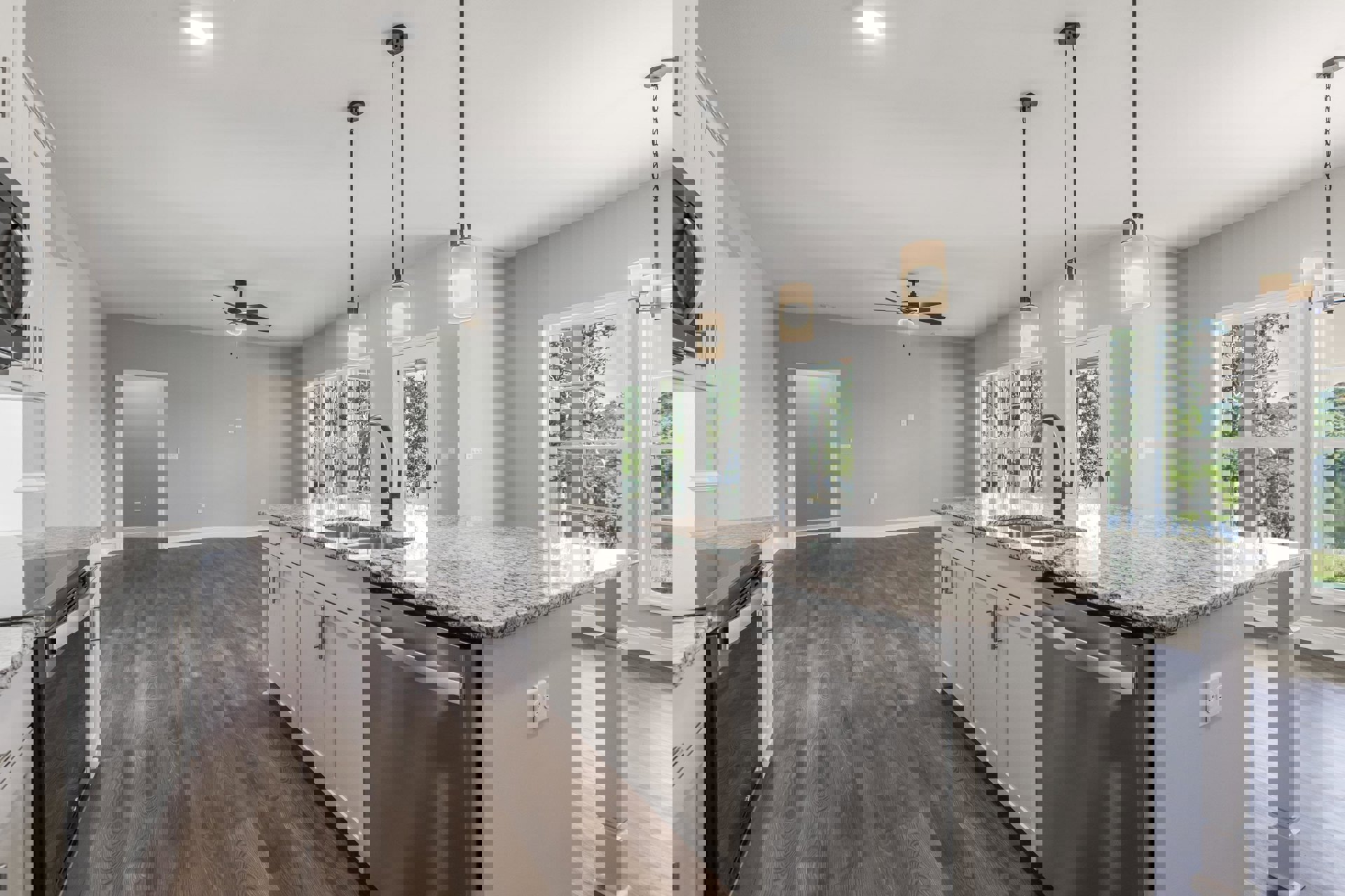 Modern kitchen with white cabinetry, dual stainless steel sinks, stone countertops, built-in dishwasher, recessed ceiling lights, and white walls with a light switch