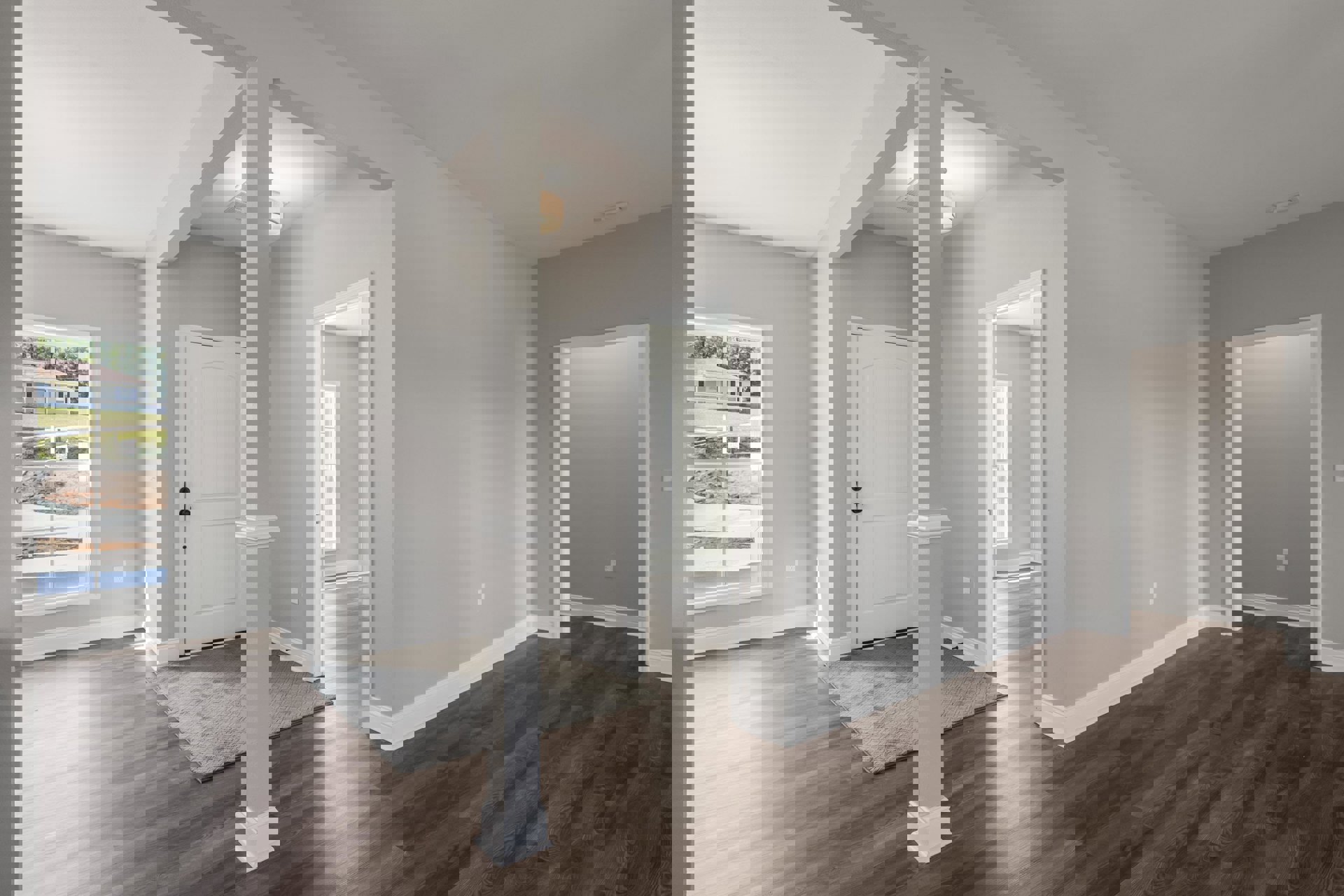 Hallway with white walls, wood laminate flooring, white door with black knobs, wall-mounted light fixture, and patterned rug