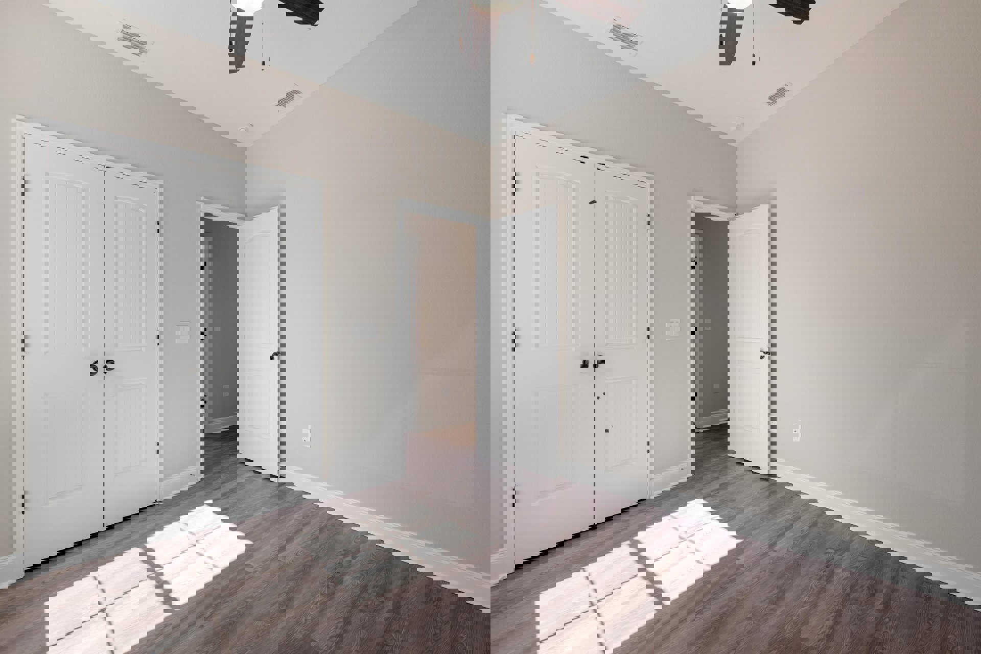 Room with white double doors featuring black knobs, wood laminate flooring, white walls, ceiling fan, recessed ceiling vent, and natural light from a window.