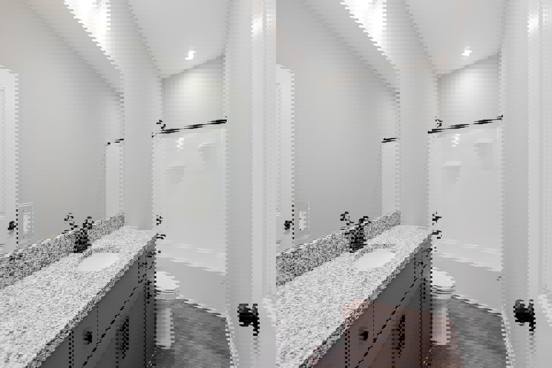 Modern bathroom with white ceramic sink, chrome faucet, glass-enclosed shower, white toilet, light gray tile walls, and built-in cabinetry