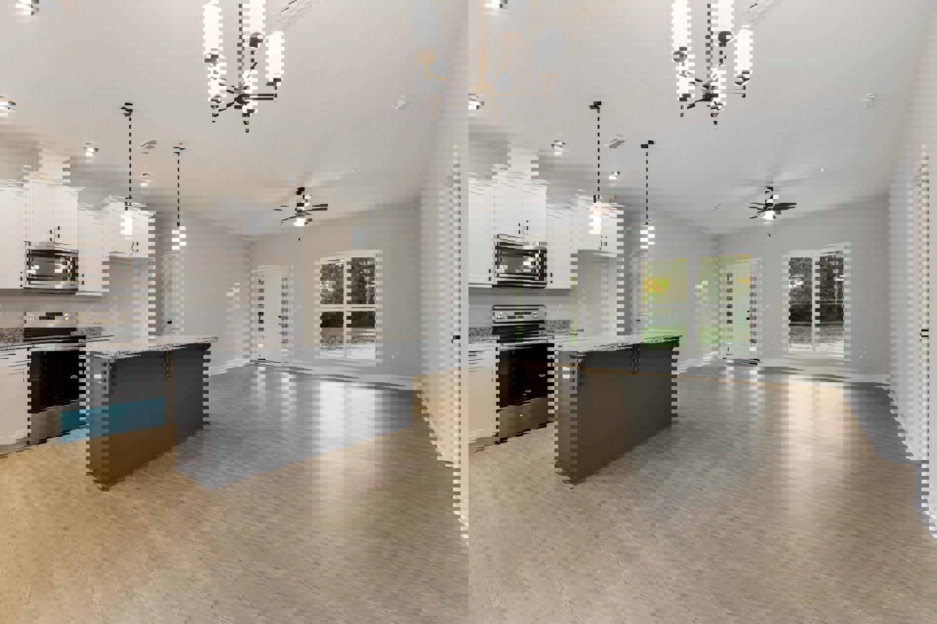 Spacious kitchen with wood flooring, white walls, central island, stainless steel appliances including microwave and stove with blue handle, large window, piano, and light-colored