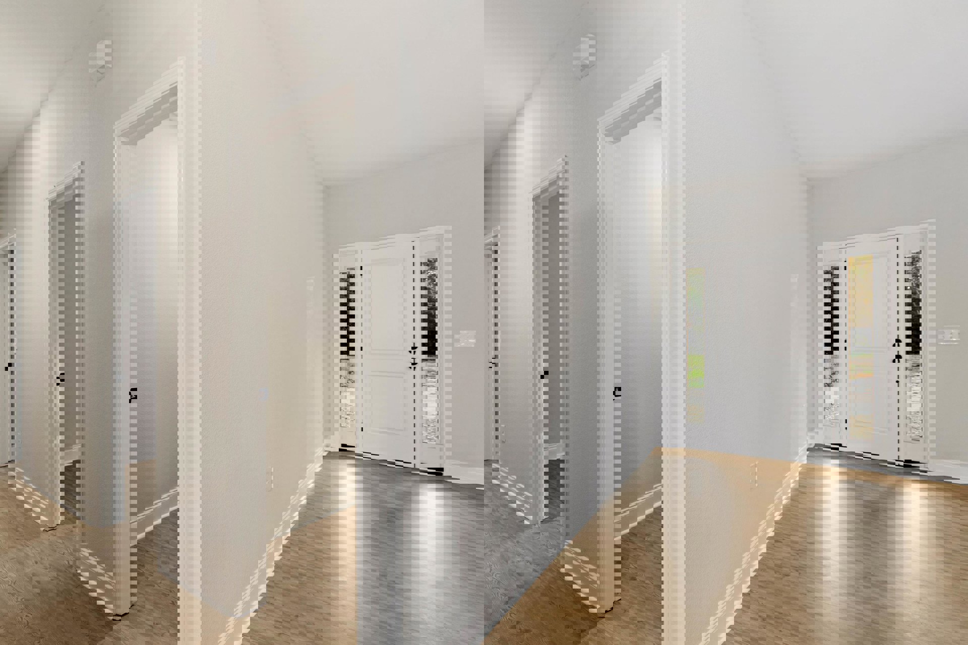 Hallway with light wood flooring, white walls, white trim, and a white door featuring glass window panes