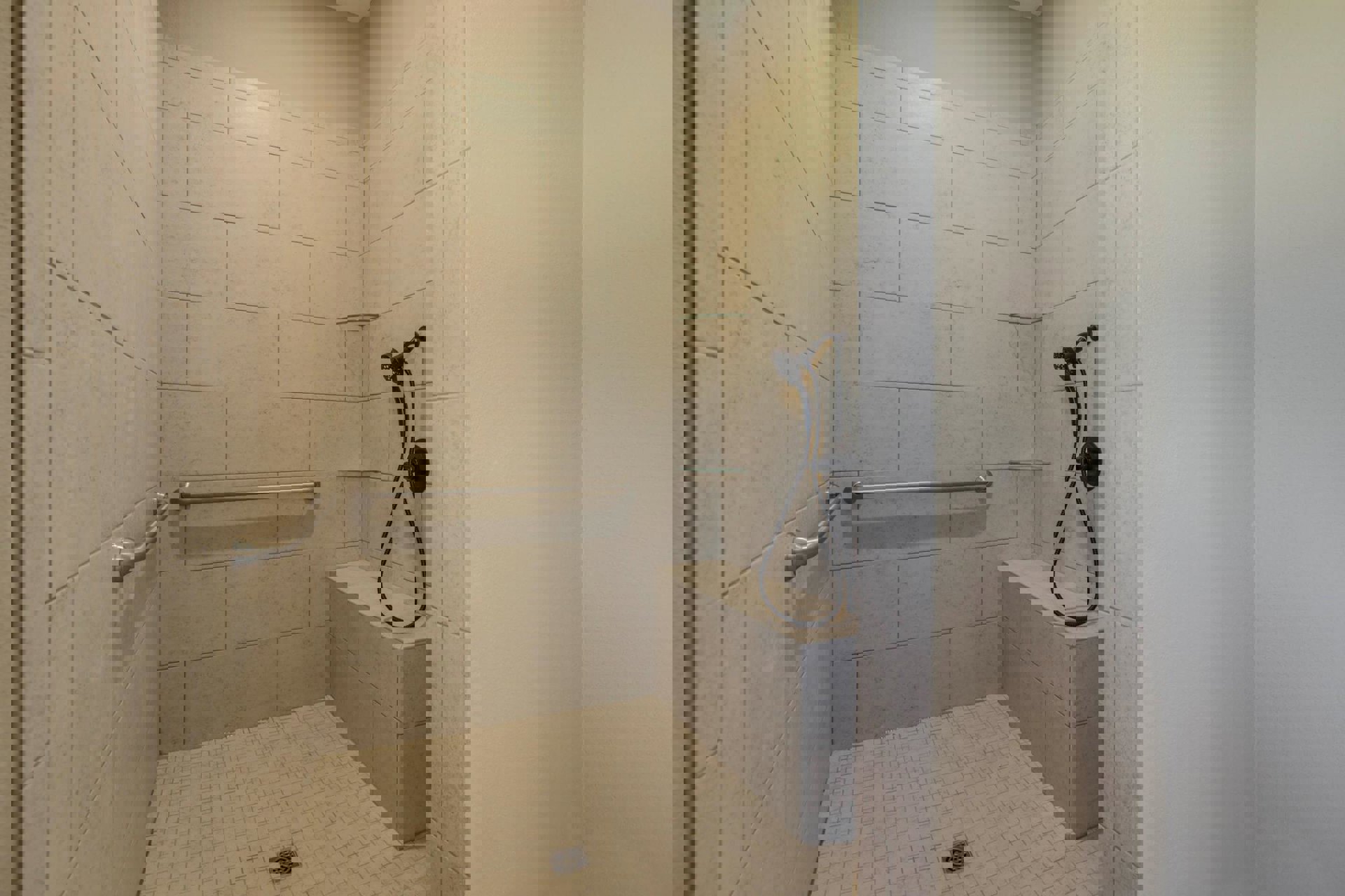 Tile shower with built-in seat, handheld shower head on hose, metal grab bar mounted to wall, and square metal drain on tile floor