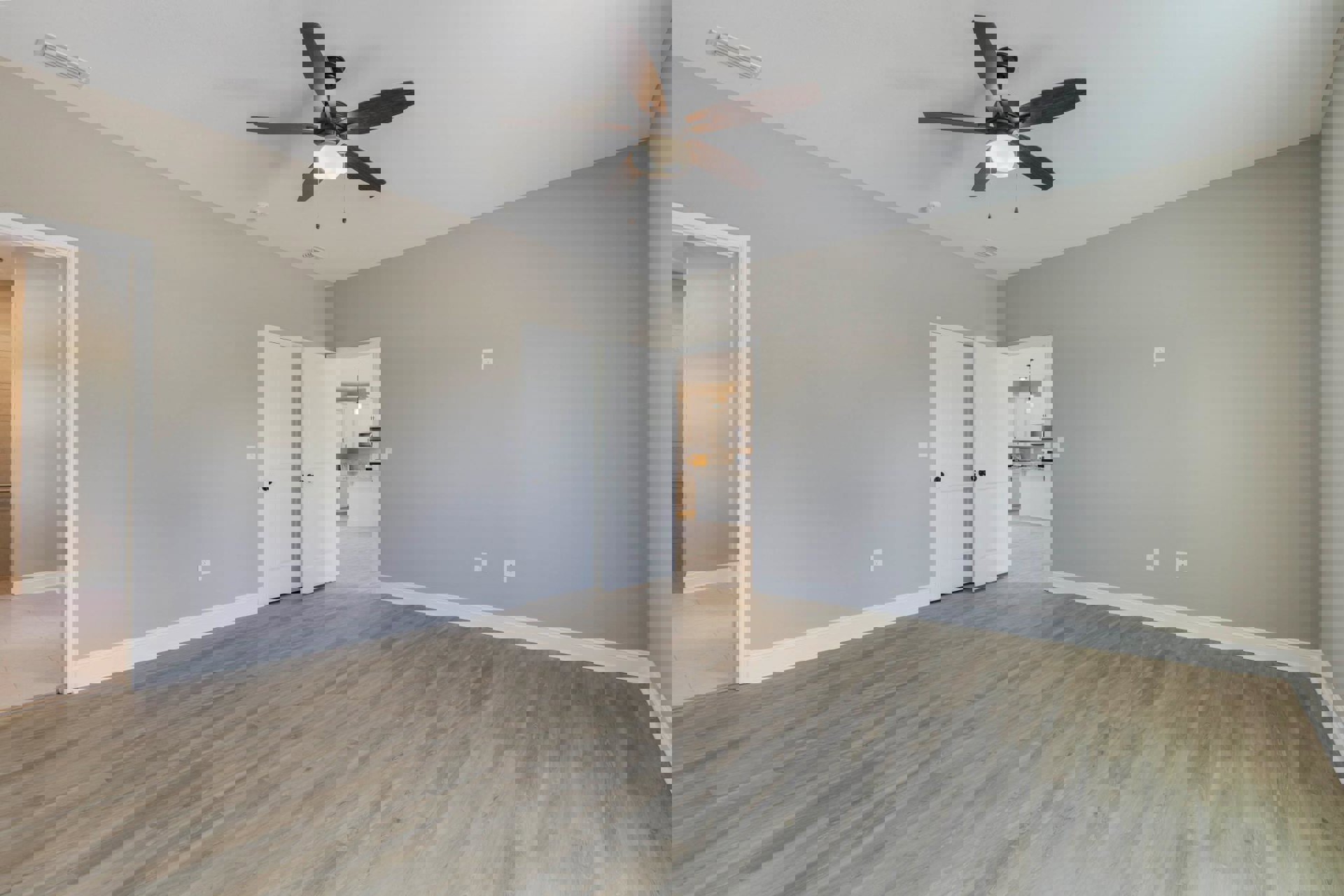 Ceiling fan with light fixture mounted on white ceiling, wood flooring, white doors with black knobs, neutral walls