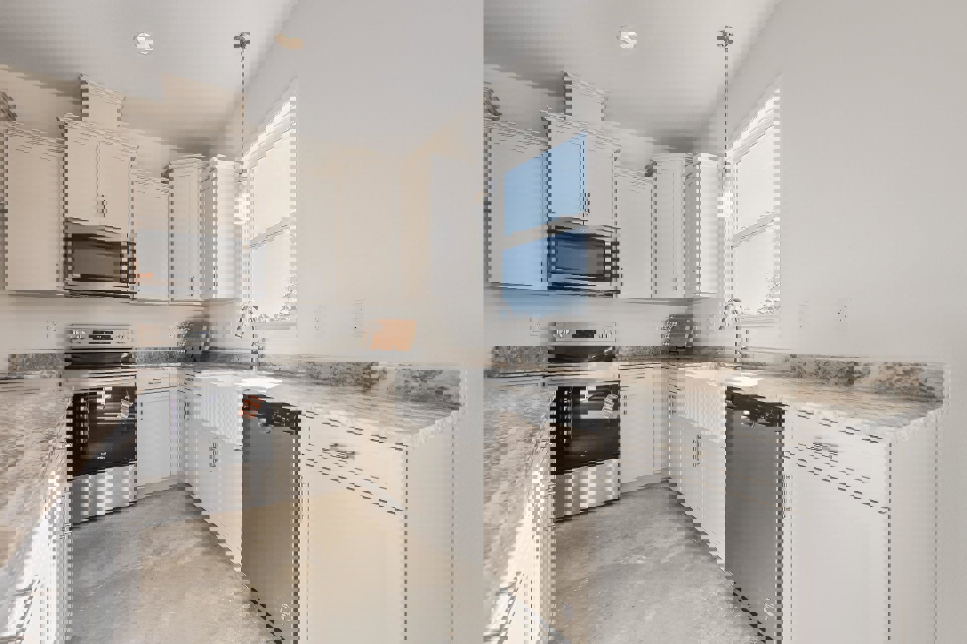 White kitchen cabinets, stainless steel sink, black and silver oven, microwave with glass door, dishwasher beneath countertop, white wall with metal pole