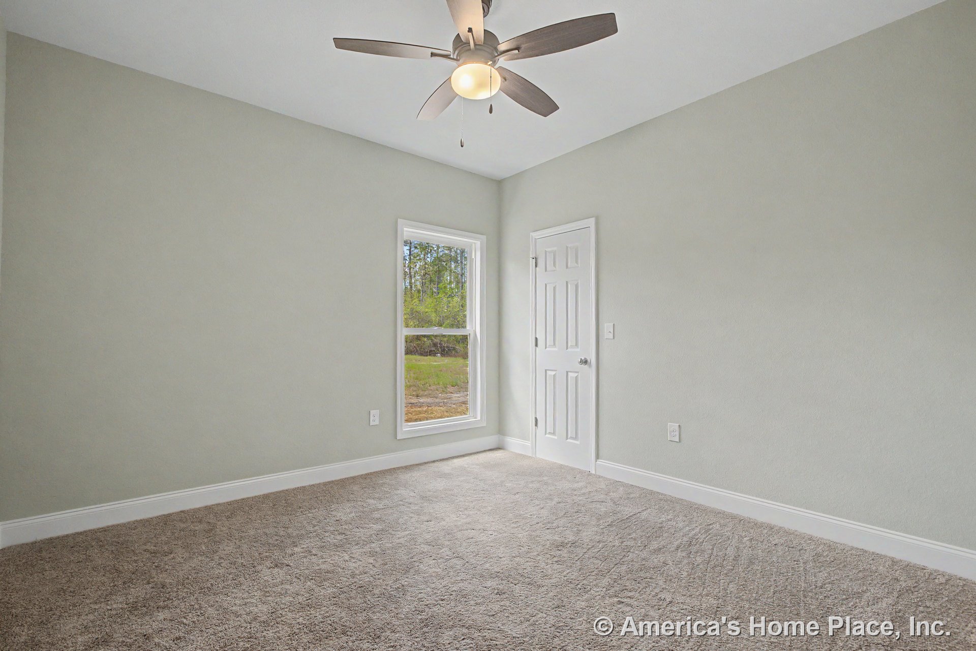 Bedroom with light carpet flooring, white baseboards, single window allowing natural light, ceiling fan with integrated light fixture, paneled door, and light gray walls with