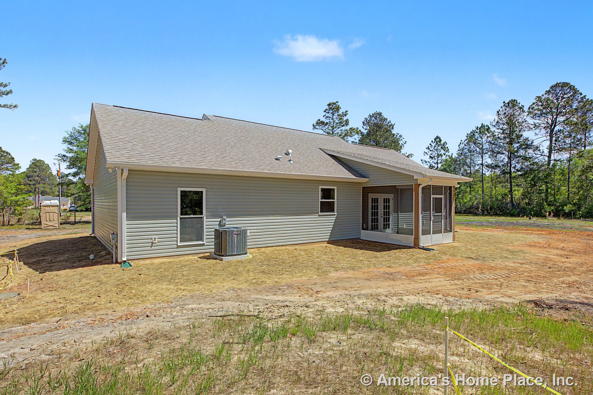 Screened porch with double exterior doors, vinyl siding, gable roof, exterior HVAC unit, and white trim.
