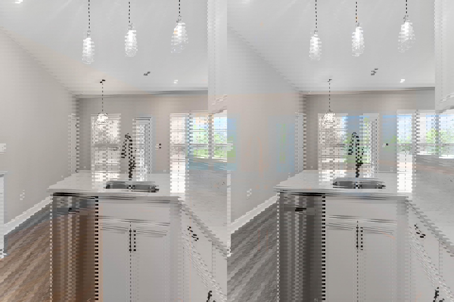 White kitchen with shaker cabinets, stainless steel dishwasher, undermount sink, quartz countertop, clear glass pendant light, and white door with glass panes