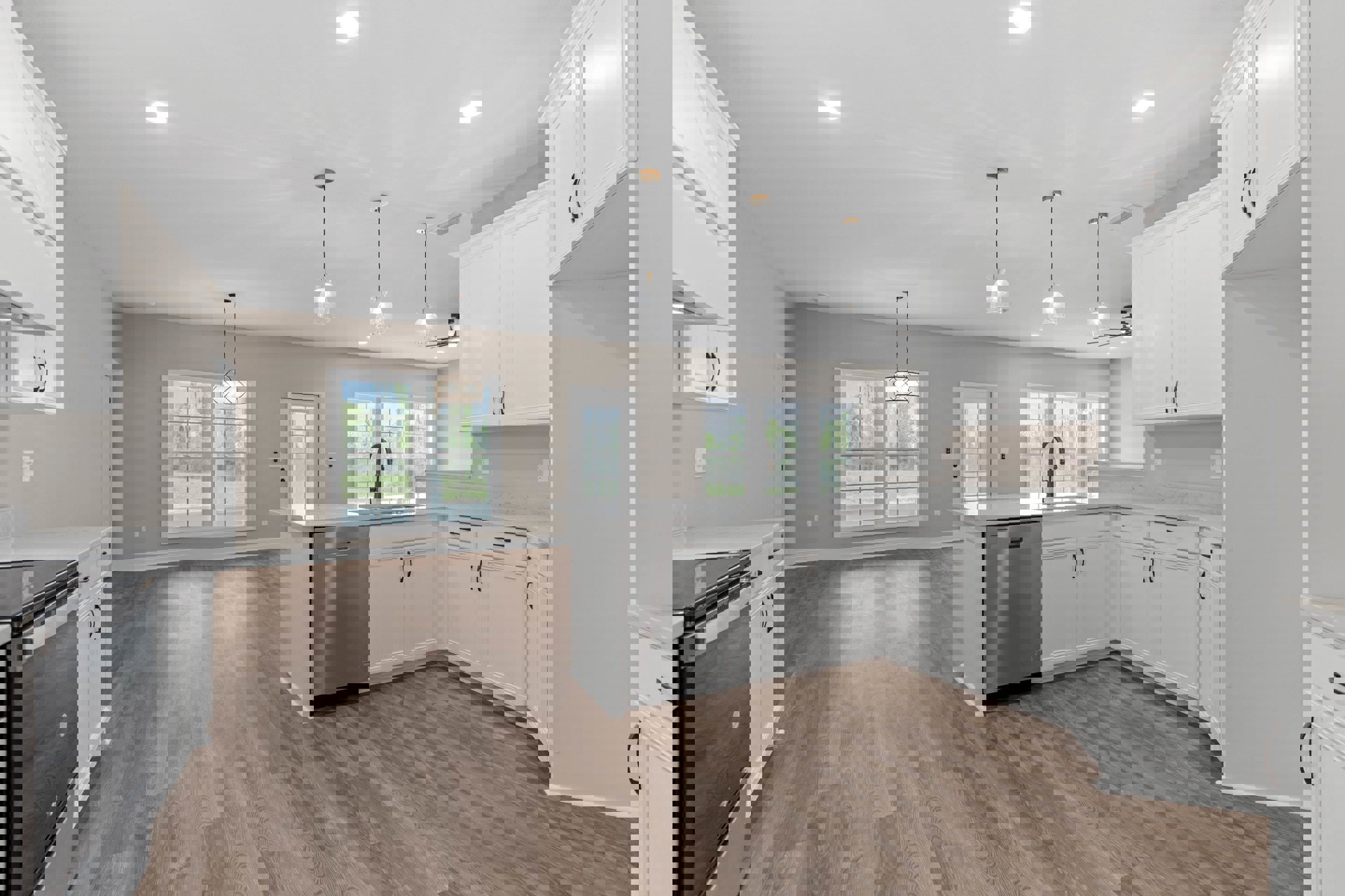 White kitchen cabinets, hardwood flooring, black dishwasher, chain-hung light fixture, ceiling light, black wire along wall, stainless steel sink, stone countertop