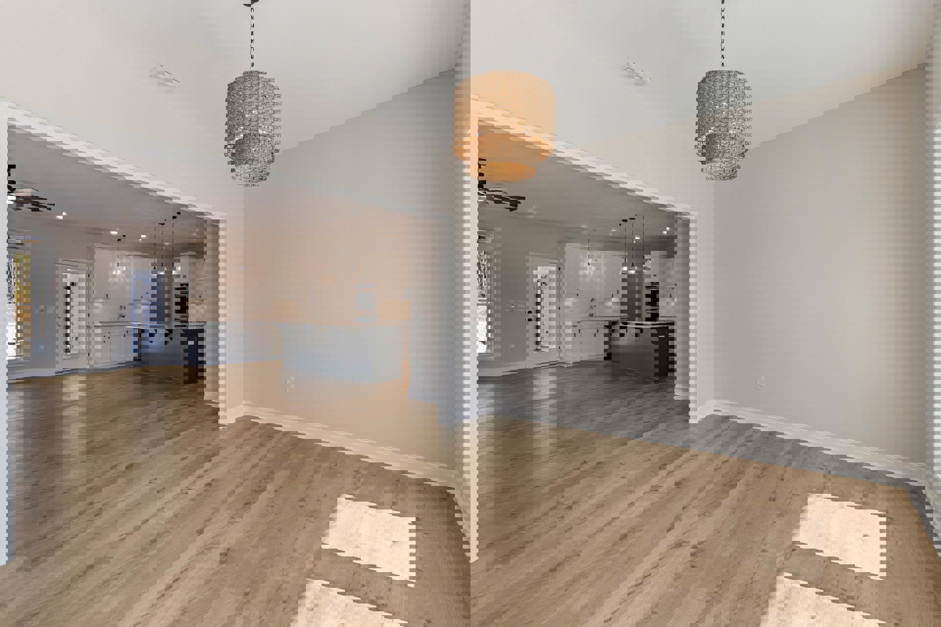 Open room with hardwood flooring, white plaster walls, woven pendant light fixture, and partial view of a white door and countertop