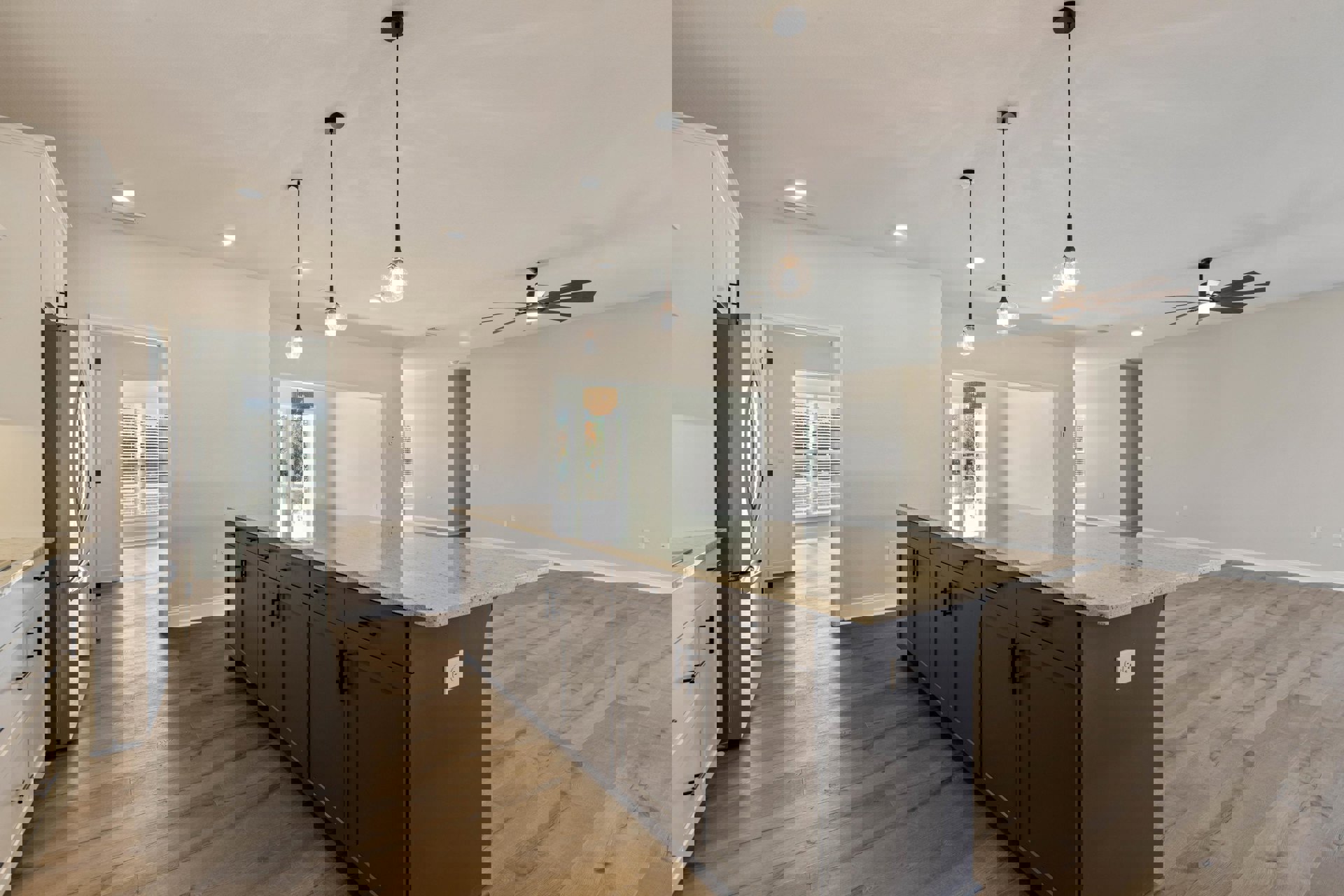 Modern kitchen featuring a central island with white countertops, wood cabinetry, ceiling fan with integrated light, recessed lighting, and white electrical outlet on the wall.