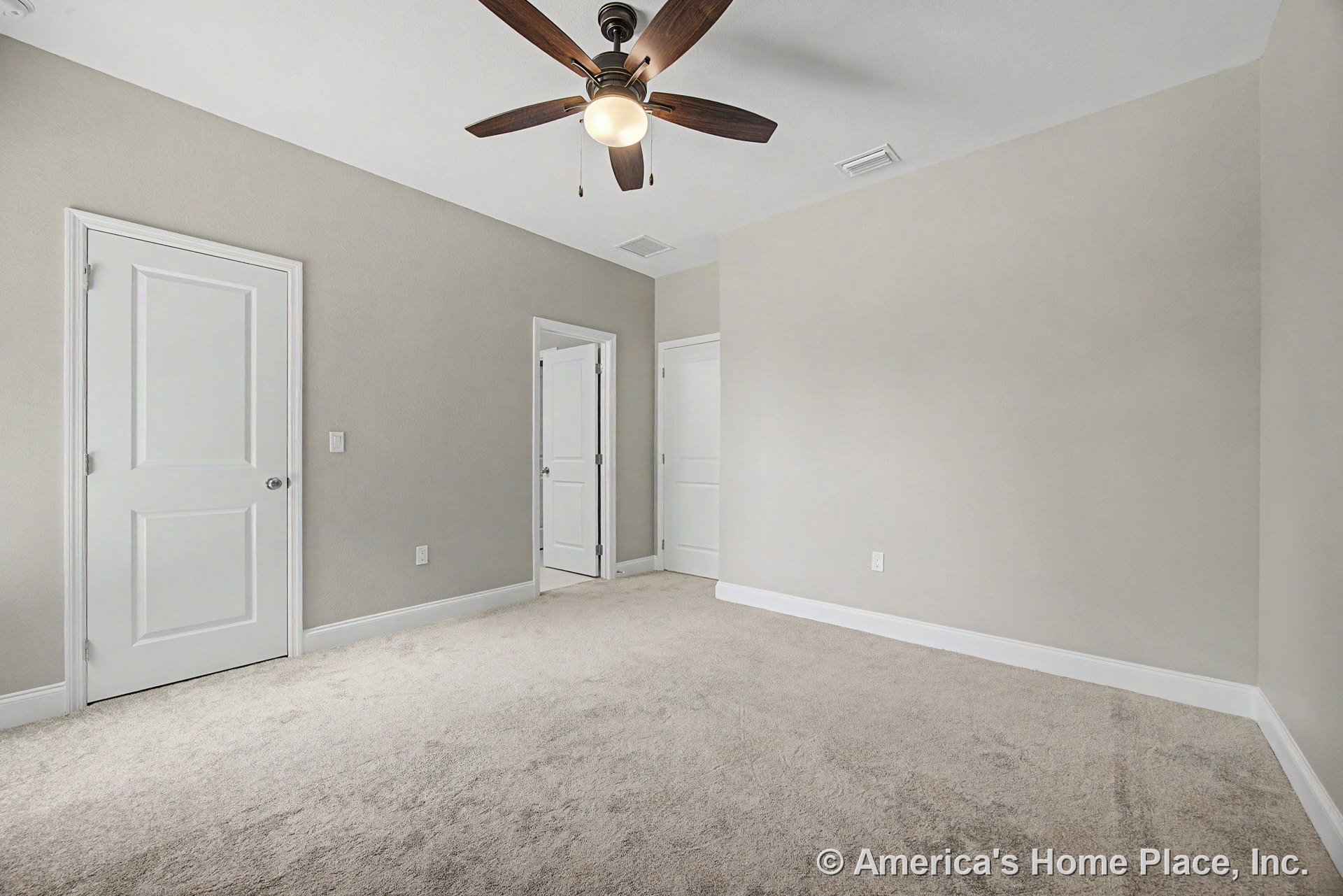 Bedroom with light carpet flooring, neutral painted walls, white paneled closet doors, white baseboards, standard ceiling height, and a ceiling fan featuring built-in lighting.