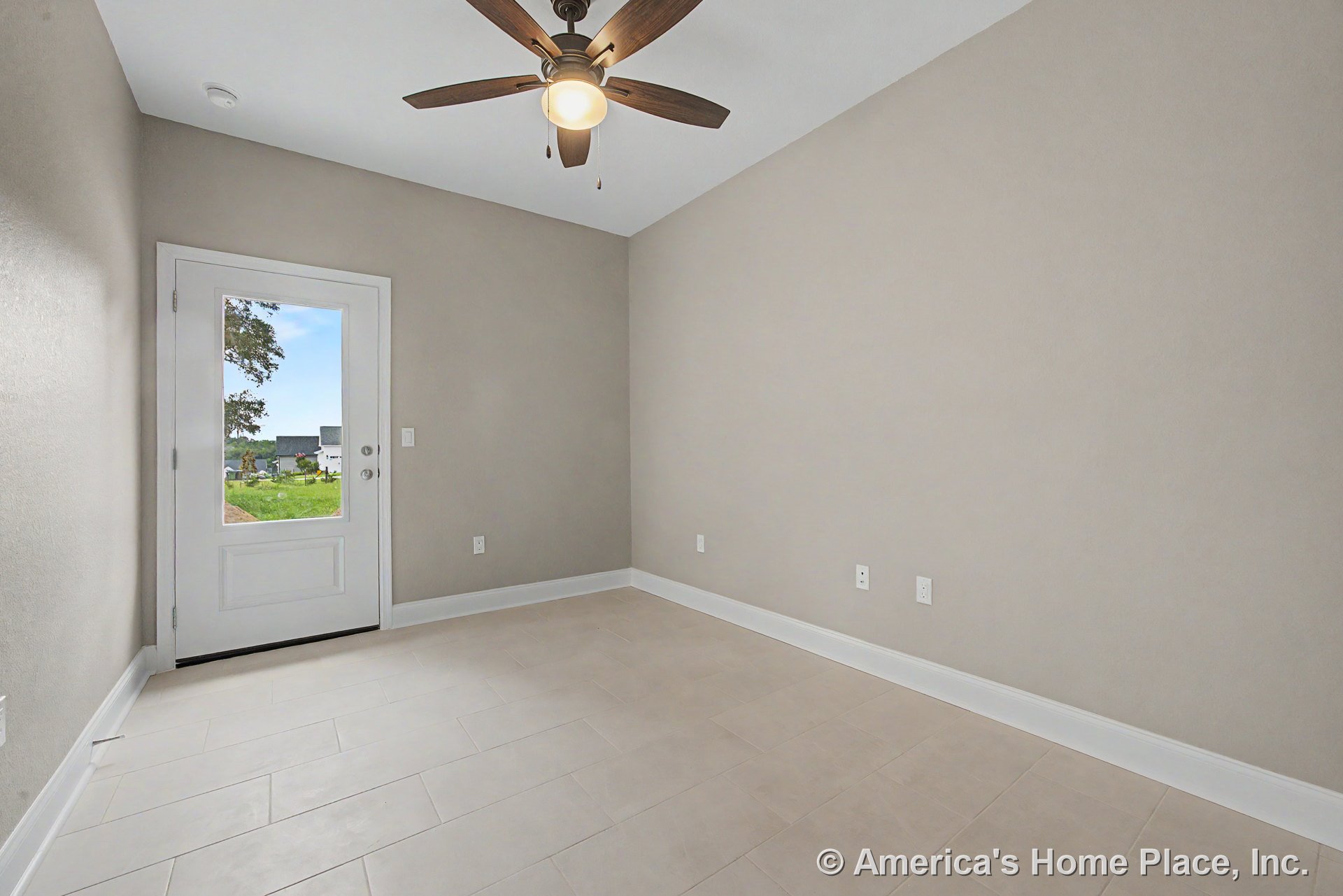 Small room with light tile flooring, beige walls, white baseboards and trim, ceiling fan with integrated light fixture, glass exterior door allowing natural light, and multiple