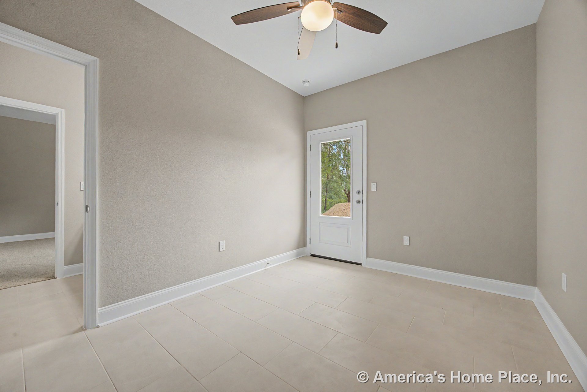 Small foyer with light beige tile flooring, white baseboards, glass-paneled exterior door, ceiling fan with integrated light, neutral wall paint, and interior doorway.