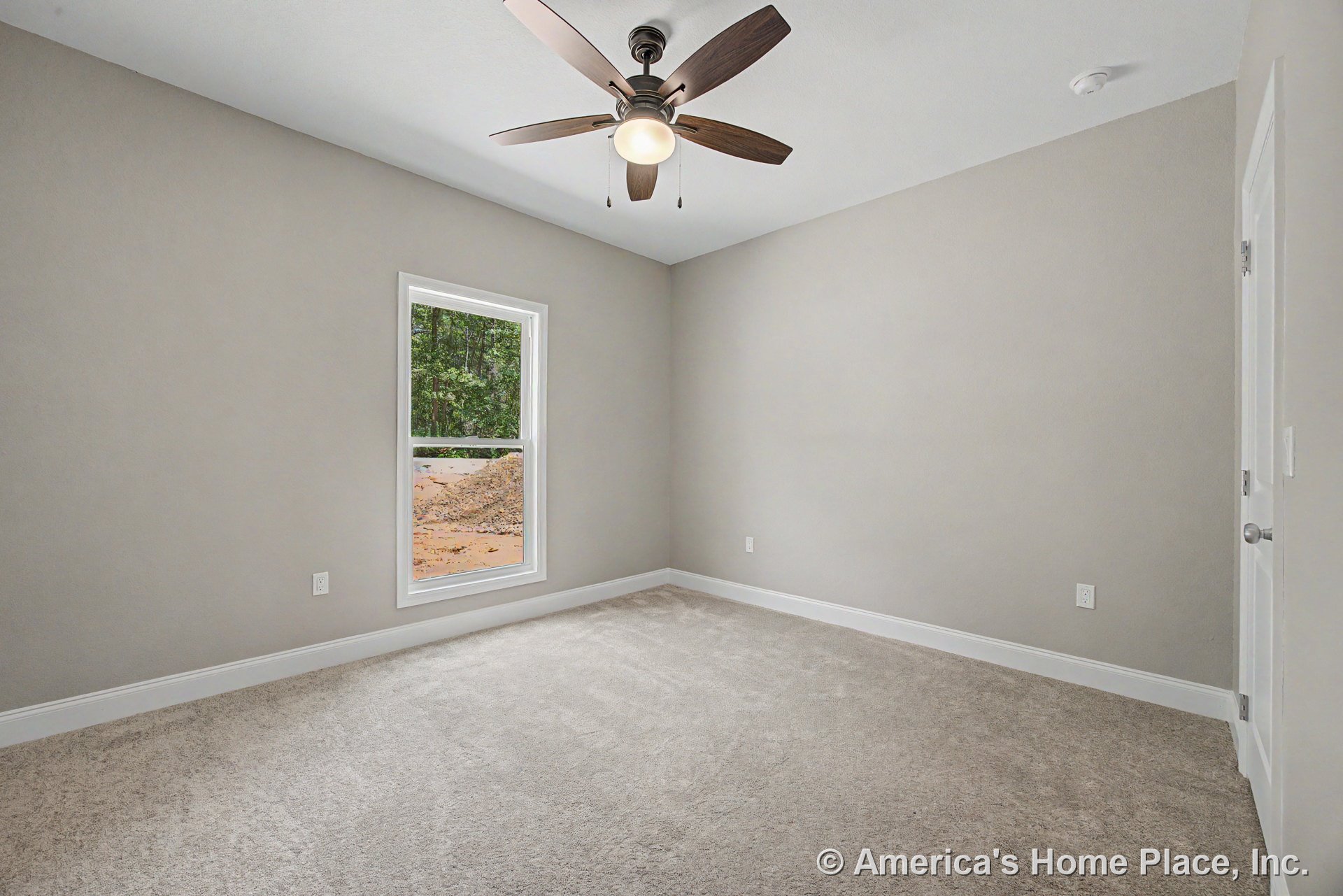 Bedroom with neutral painted walls, white baseboard trim, light carpet flooring, single hung window, ceiling fan with integrated light fixture, and smoke detector mounted on