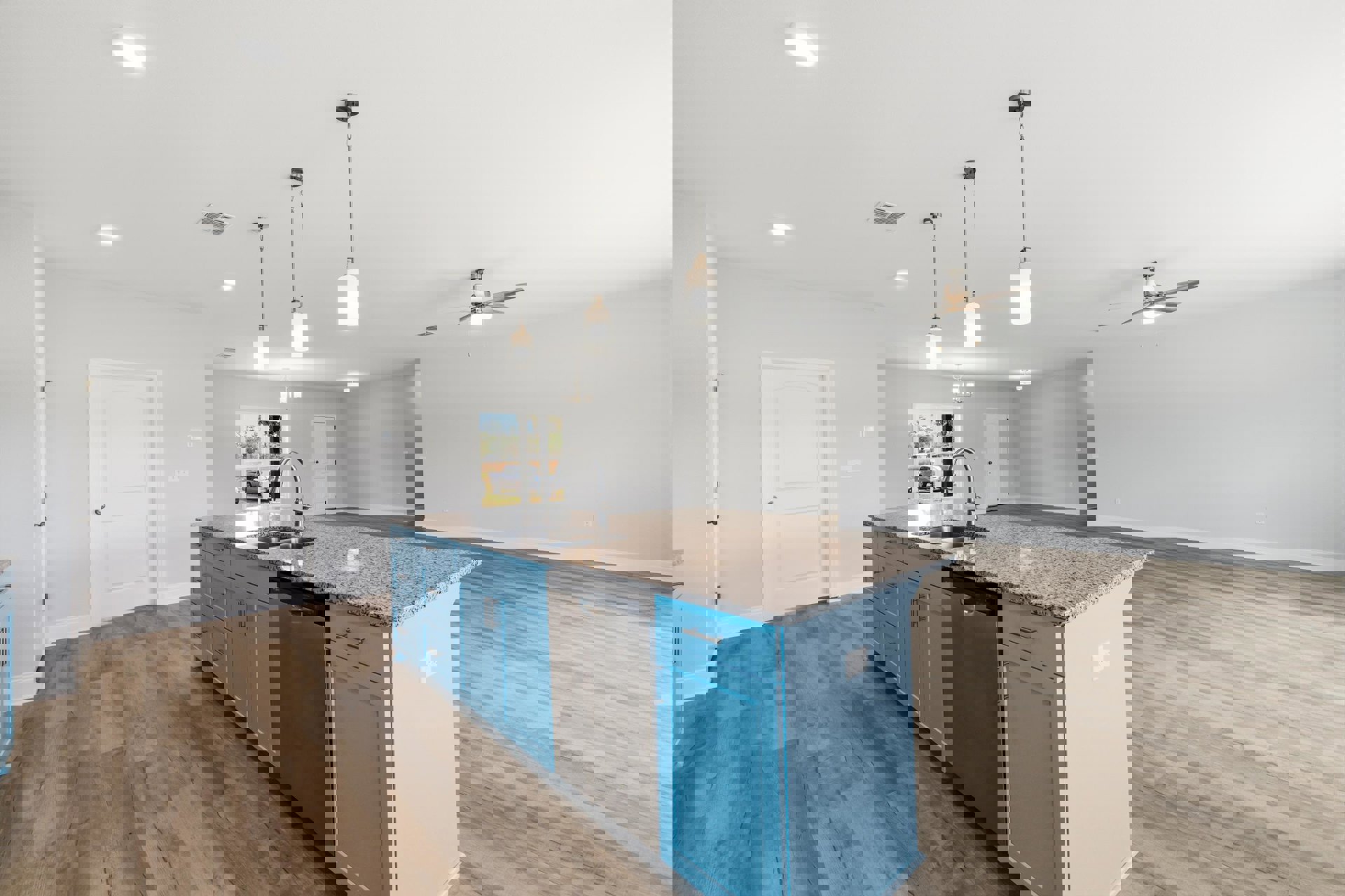 Kitchen with blue cabinets, stainless steel dishwasher, large central island with sink, white walls, and light wood flooring