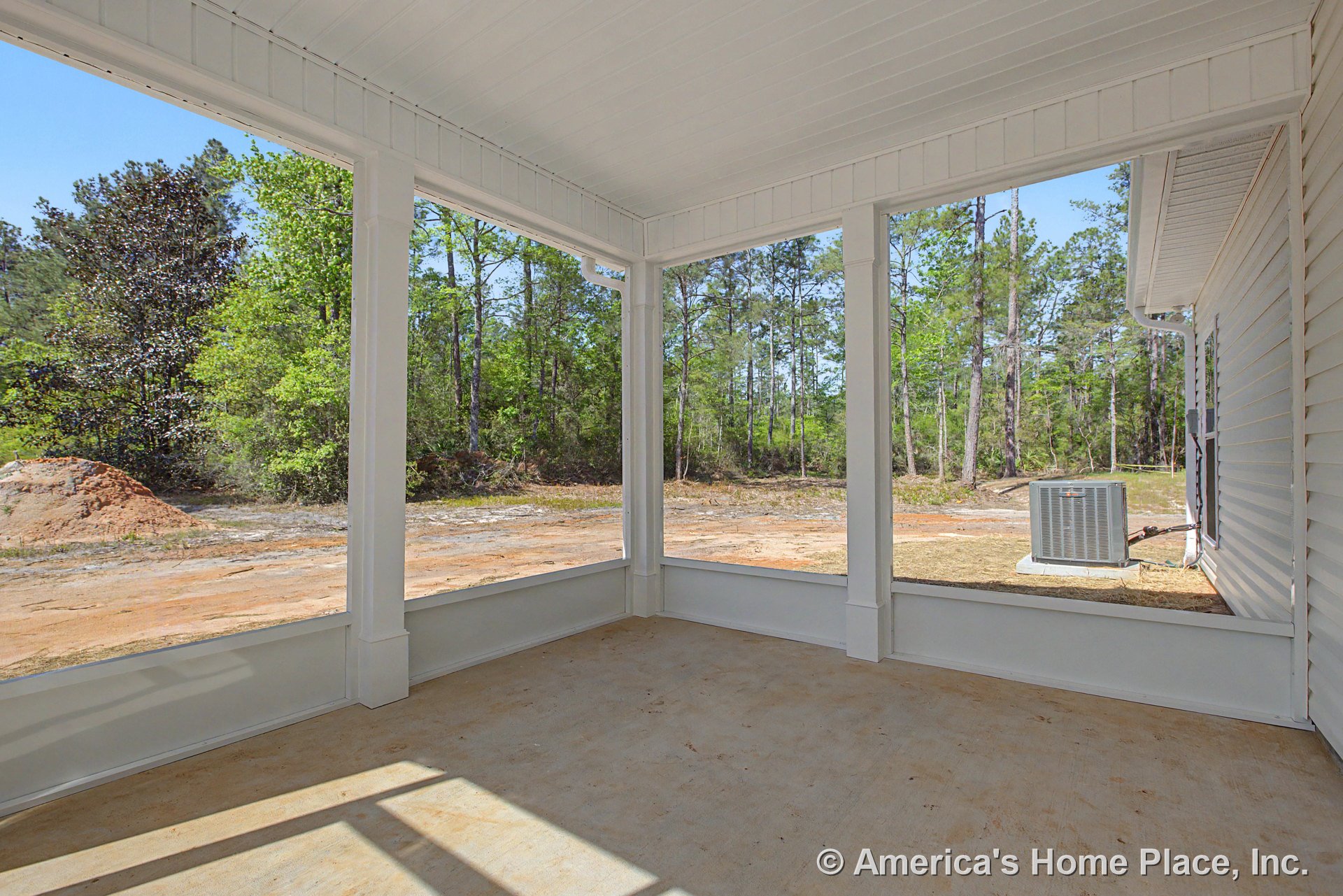 Covered screened porch with white painted trim, concrete flooring, exterior siding, open ceiling panels, and built-in outdoor HVAC unit.