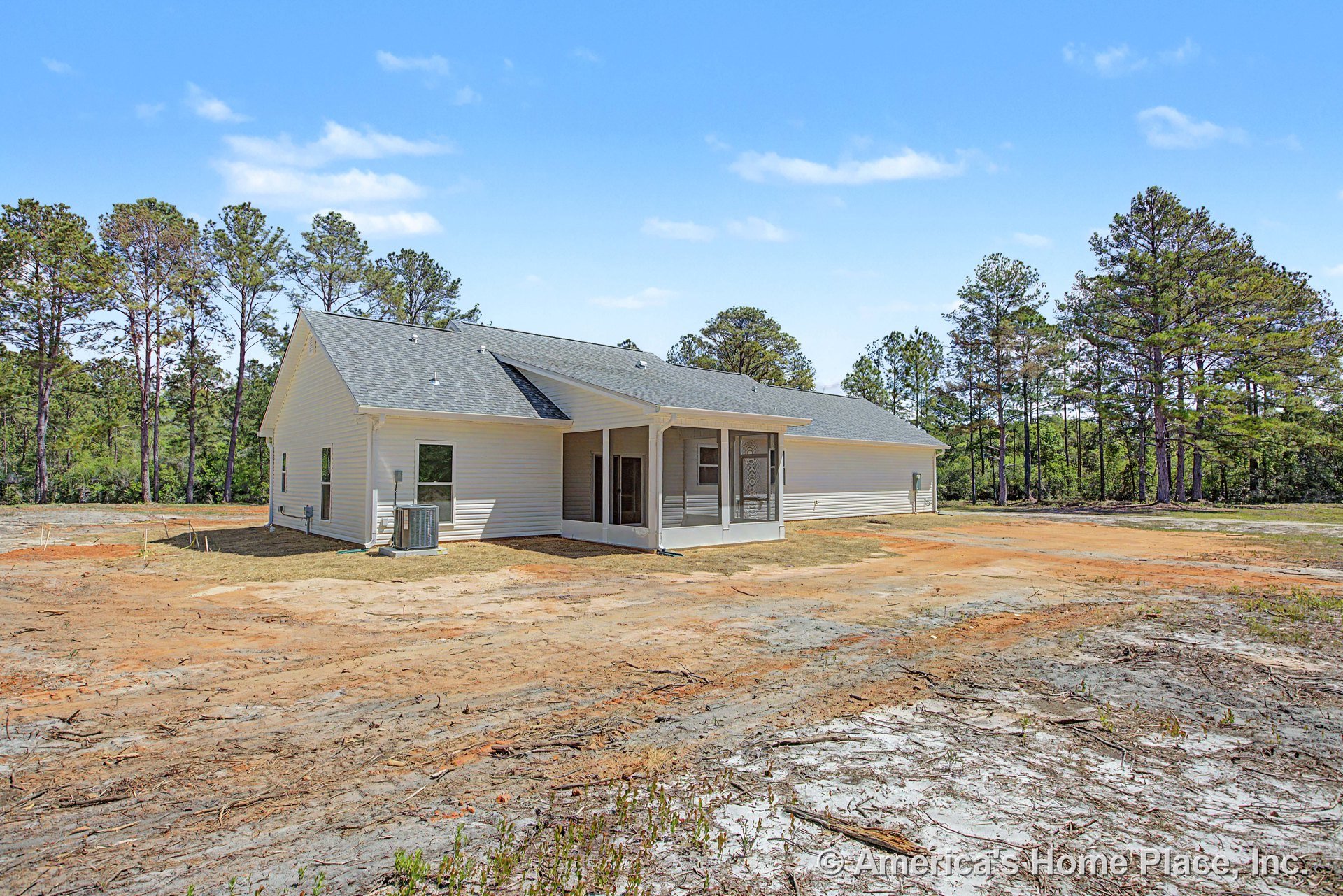 Covered rear porch with screened enclosure, light-colored vinyl siding, shingle roof, multiple windows, exterior HVAC unit, and white trim on single-story home.