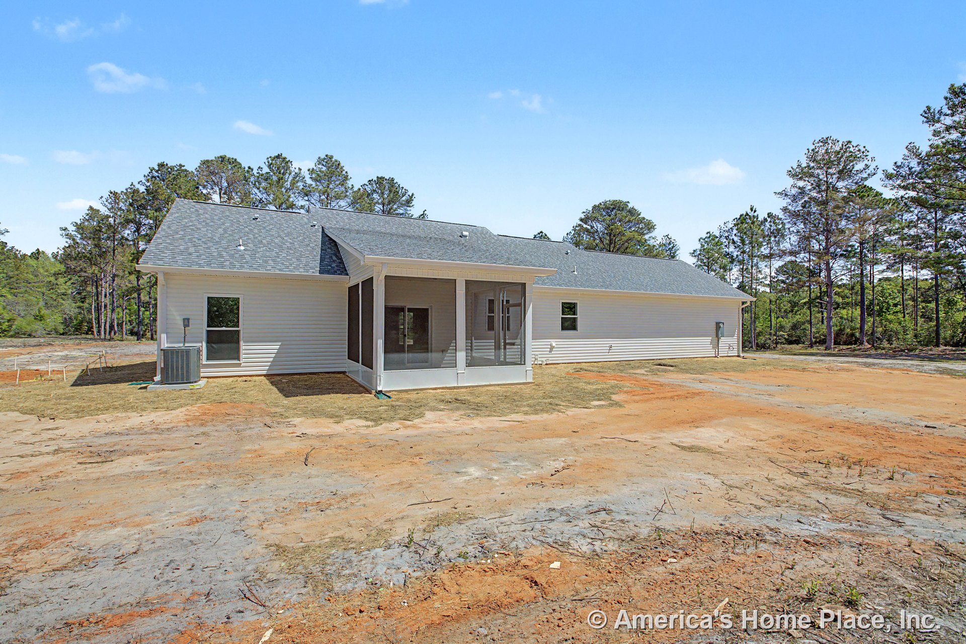 Screened rear porch with white vinyl siding and gray shingle roof, multiple exterior windows, single-story layout, expansive backyard, and outdoor living space.