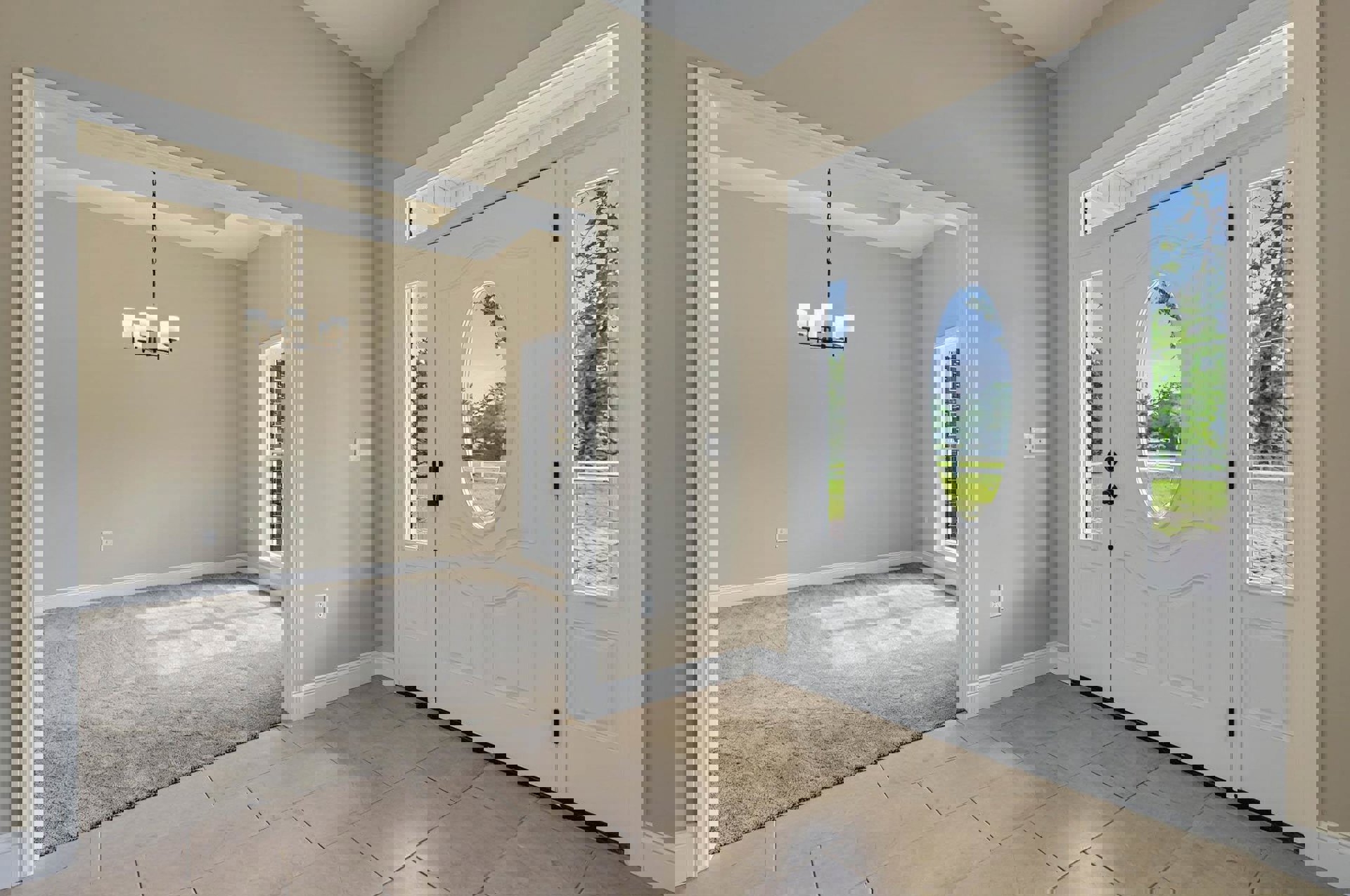 White paneled door with glass window, beige carpet flooring, white walls, and a window overlooking leafy trees