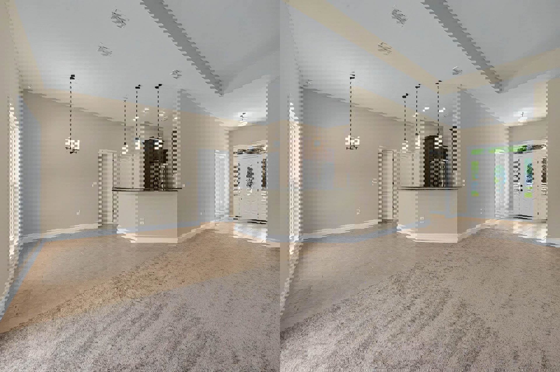 Open concept living room with carpeted floor, adjacent kitchen featuring stainless refrigerator, dining area, white doors with silver handles, and ceiling chain fixture.