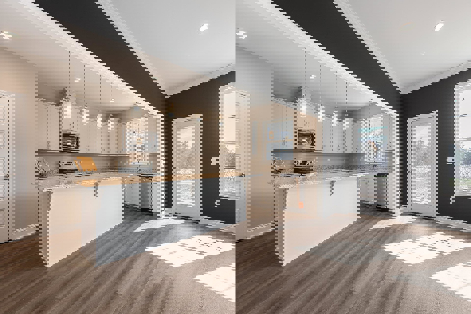 Open kitchen with wood flooring, white cabinetry, stone countertops, built-in microwave, glass-paneled door, and window with white trim