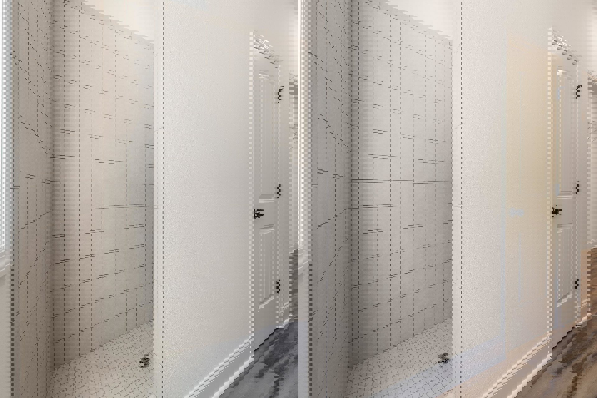 White tiled shower with matching tile floor and white grout, adjacent to a white wall and close-up of a white door in a custom Franklin bathroom.