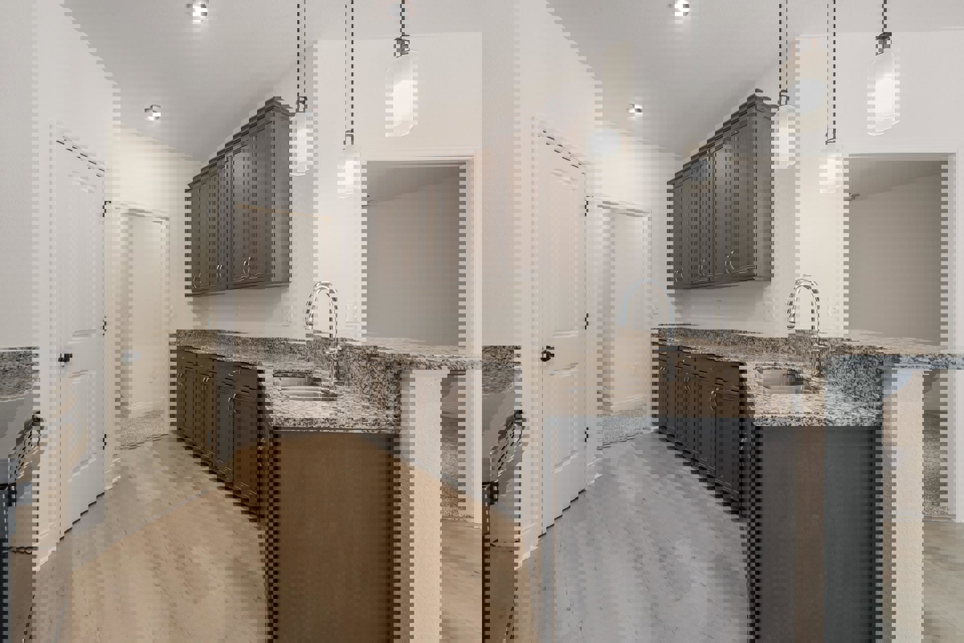 Granite countertops with undermount sink, white cabinetry, stainless steel appliances, and black hardware in a bright kitchen