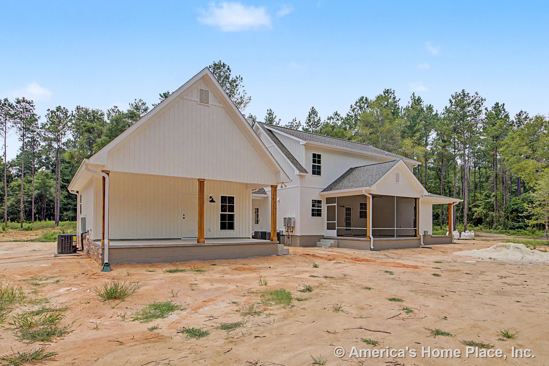 White vertical siding exterior with multiple gable roofs, covered front porch supported by wood columns, screened rear porch, several exterior doors, windows with trim, foundation