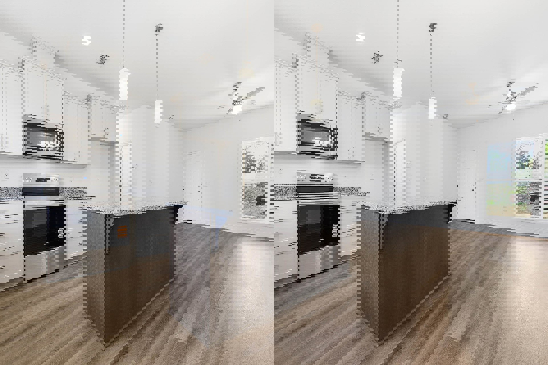 Kitchen with marble countertop bar, wood flooring, stainless steel stove with glass door, built-in microwave, white pendant light, cabinetry, and window overlooking yard