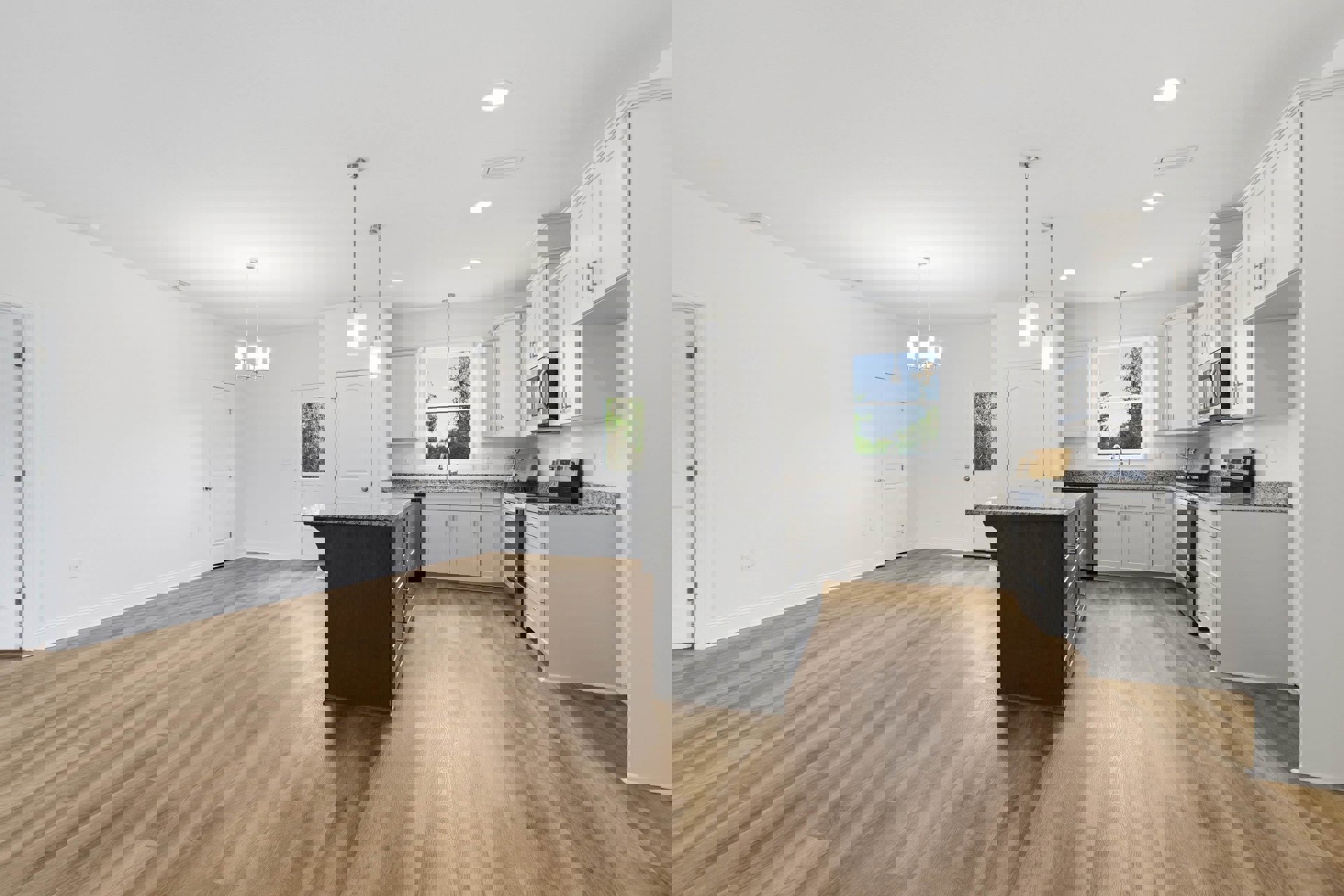 Hardwood floor kitchen and dining area with black island drawers, window above sink with visible cord, wood floor and black countertop, wall-mounted microwave, person standing at