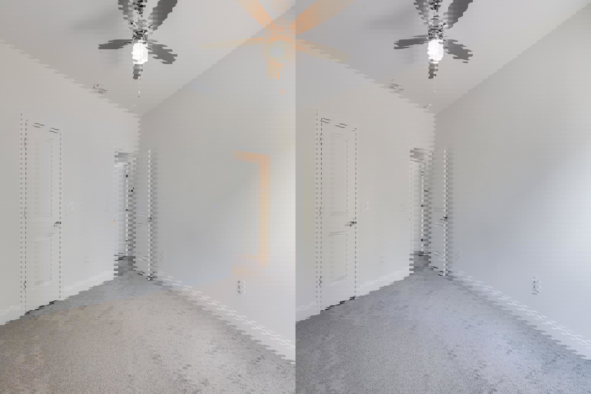 Ceiling fan with light fixture mounted on white plaster ceiling above white carpeted floor, open white door with silver handle leading to adjacent room.