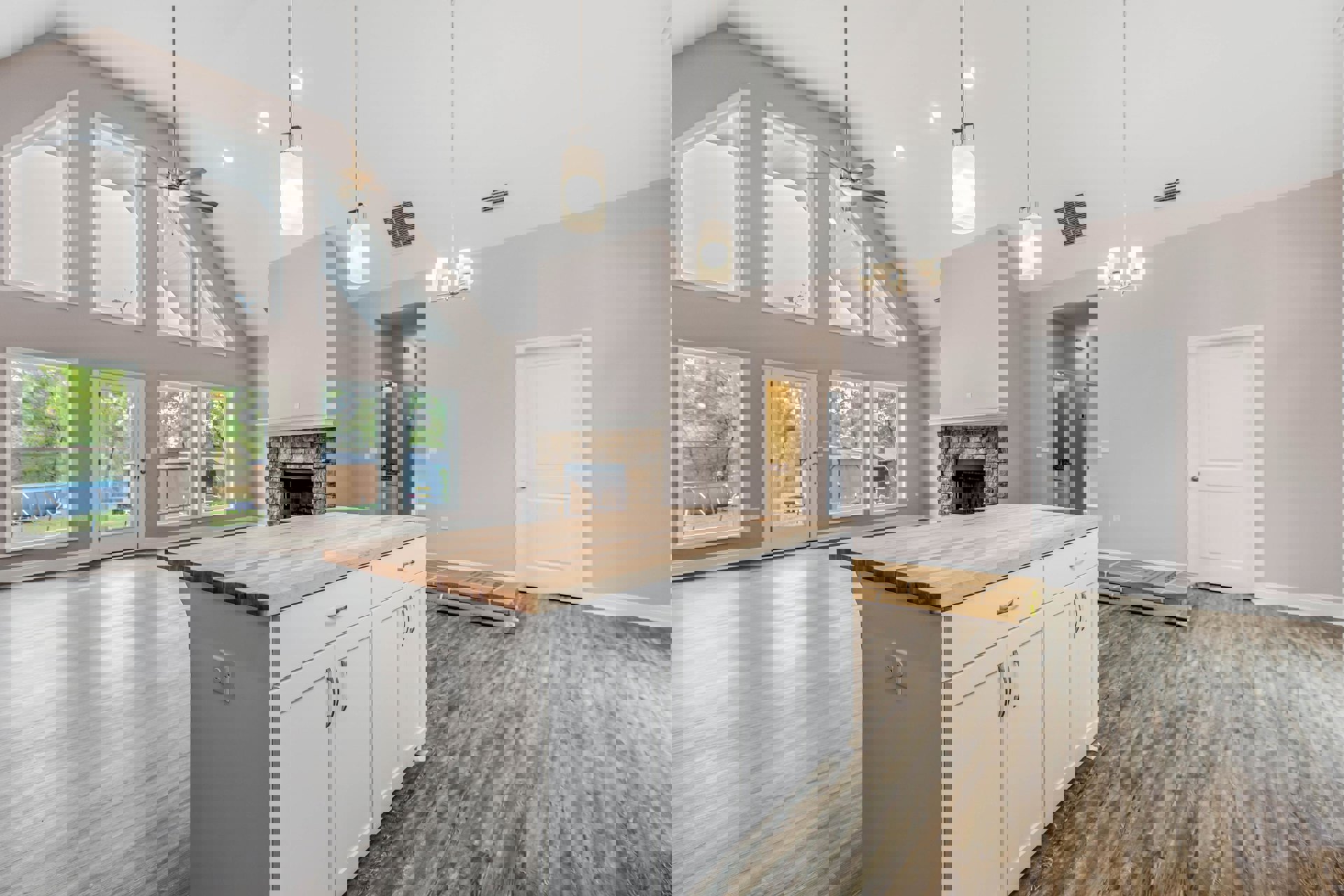 Kitchen with wood countertop island, white cabinetry, stainless steel appliances, circular ceiling light fixture, window overlooking backyard pool, door opening to patio with