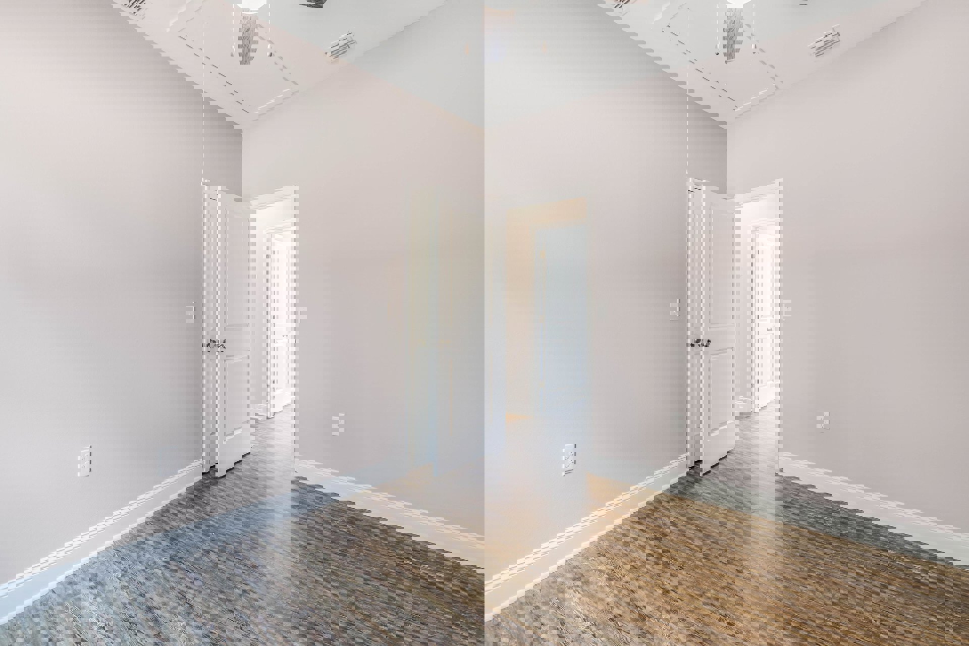 Room with wood flooring, white walls, open white door with silver handle, glass-paneled door, ceiling fan with light fixture