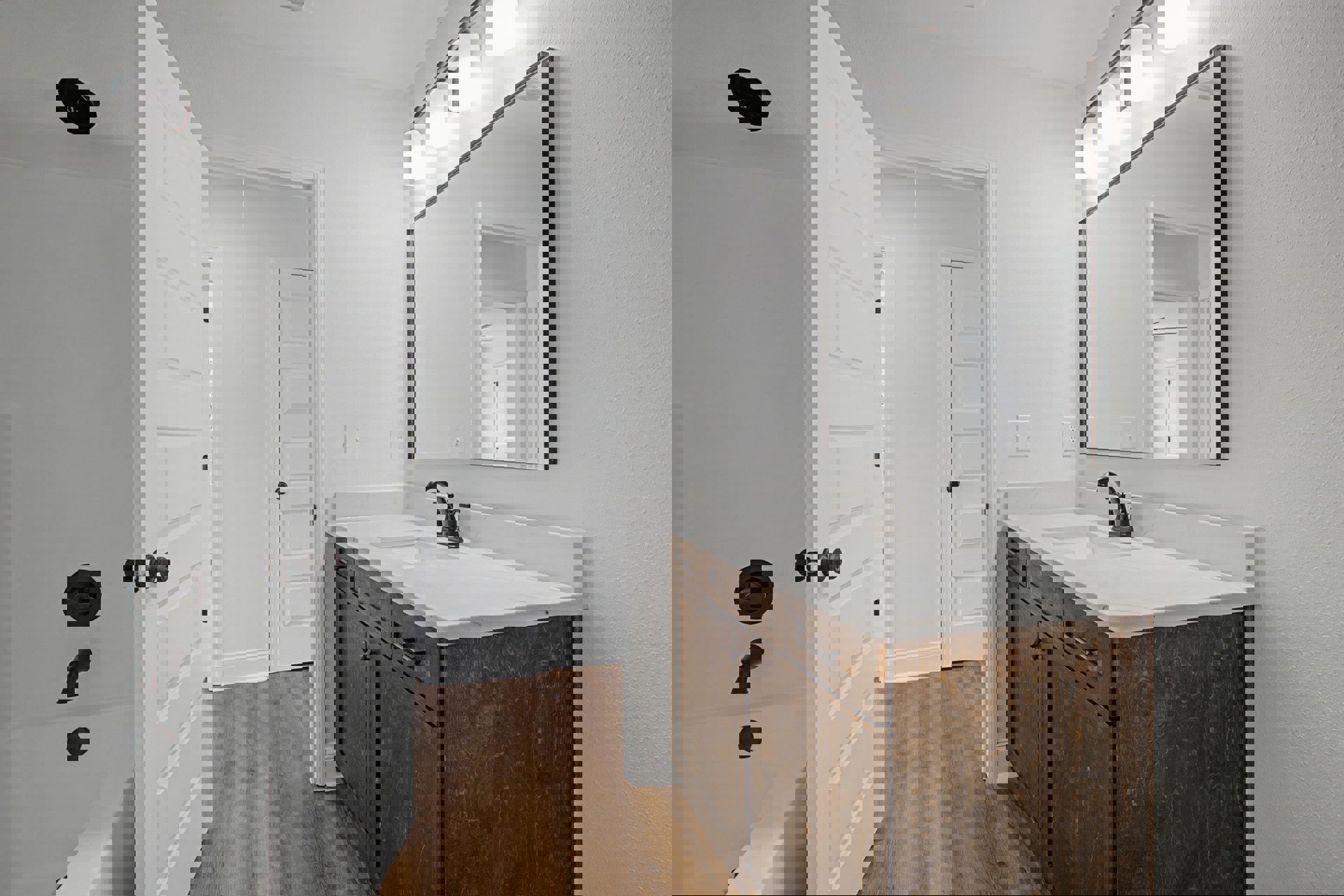 White bathroom vanity with undermount sink, black faucet, quartz countertop, large illuminated mirror, and light gray tile backsplash