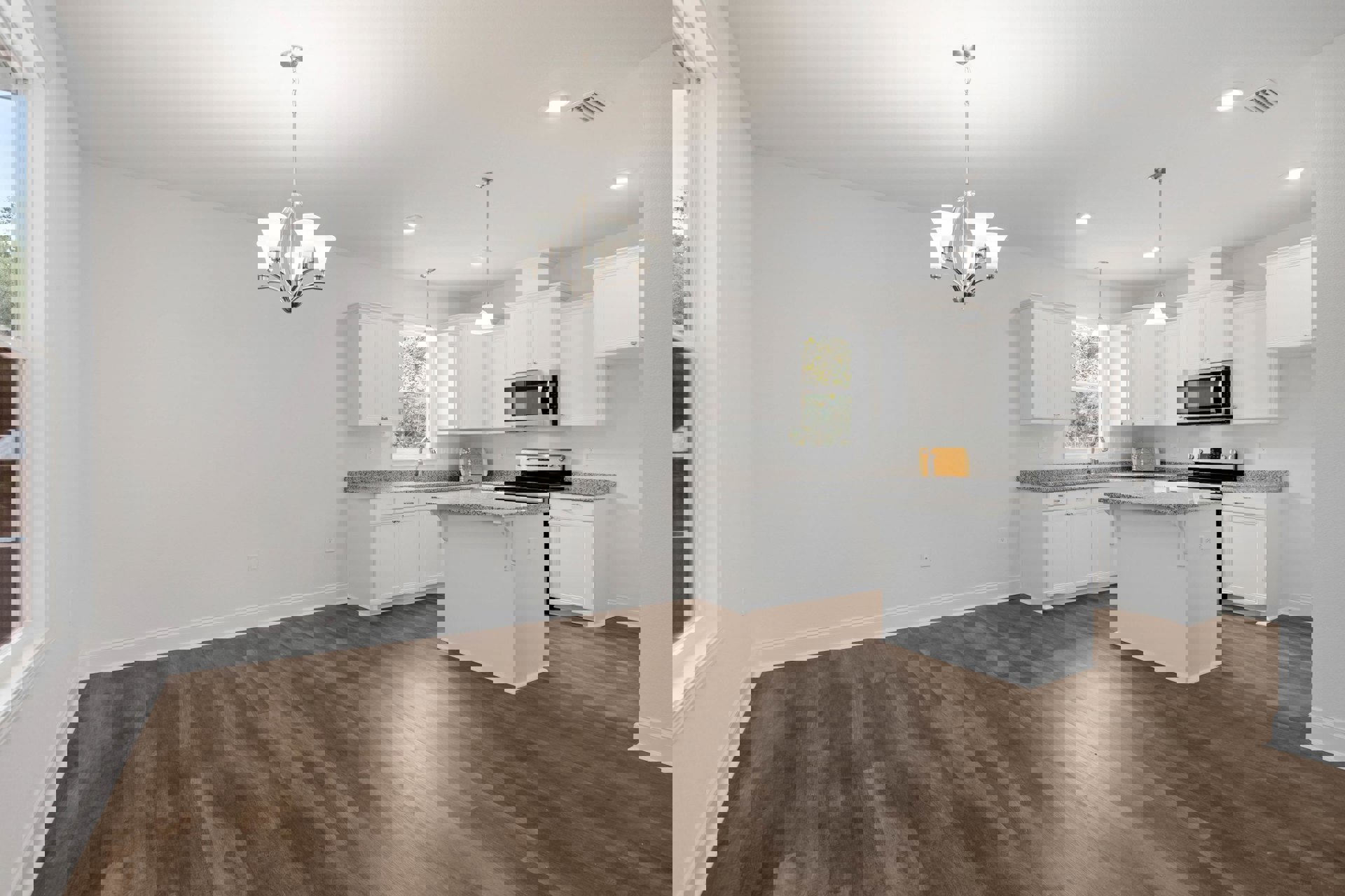 White kitchen cabinets and island with black stove, wood flooring, built-in microwave, chandelier, and stainless steel sink