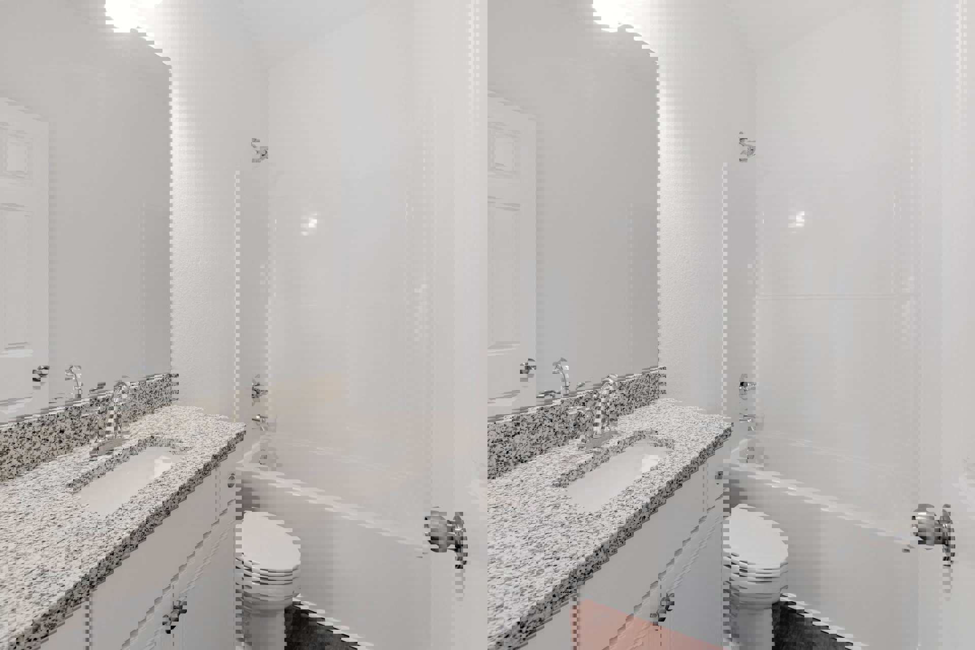 Modern bathroom with white ceramic sink, rectangular mirror, and closed white toilet, surrounded by light gray tile walls and chrome fixtures