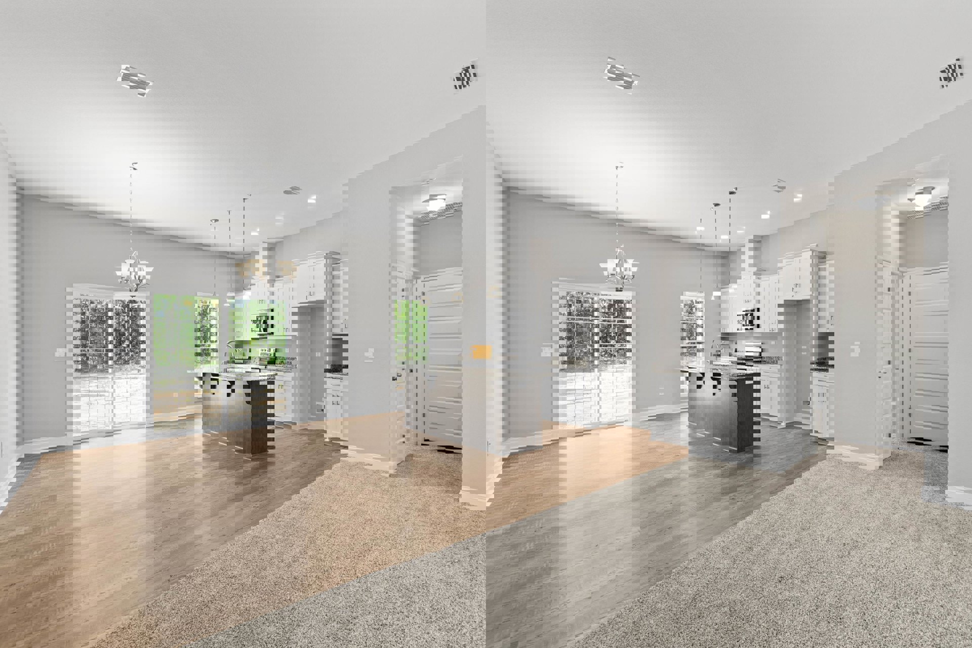 Spacious open floor plan featuring a kitchen with a marble-topped island, wood cabinetry, hardwood flooring throughout, sliding glass door overlooking trees, white interior door