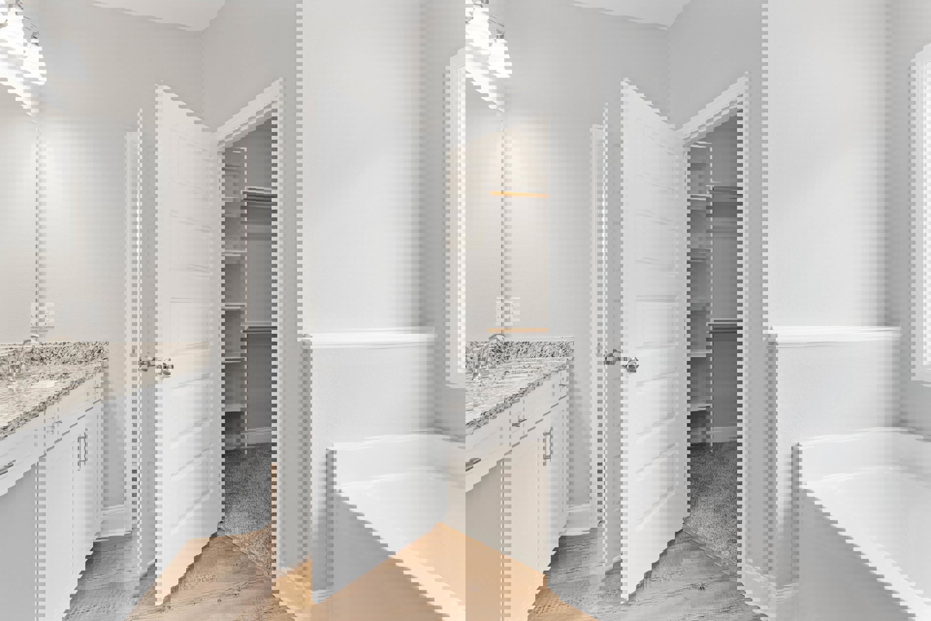 White door with silver knobs open to a closet with shelving, white walls, and red carpet flooring