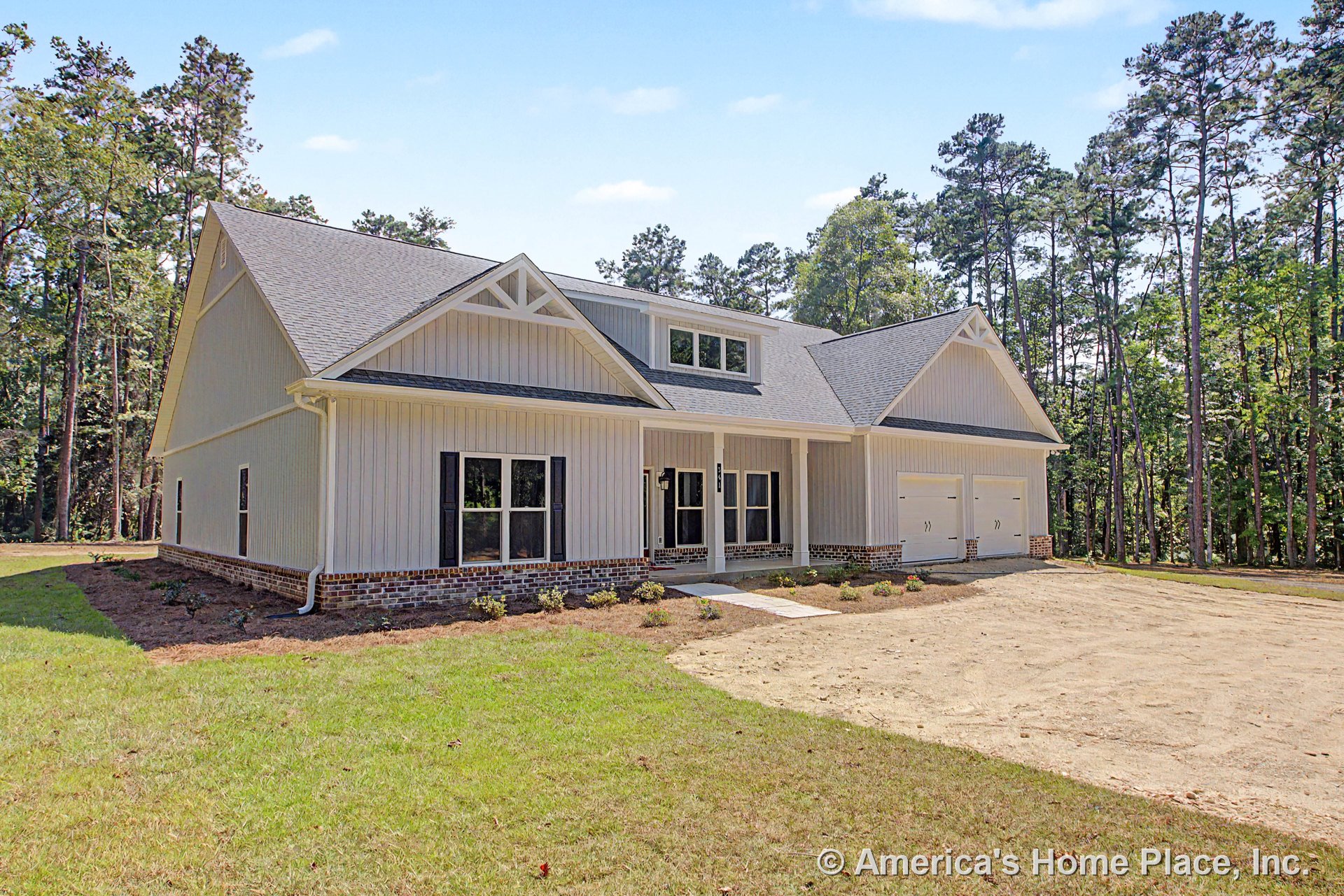 Board and batten siding with brick foundation trim, double garage doors, black window shutters, gabled roof featuring a decorative truss, covered front entry porch, and vertical
