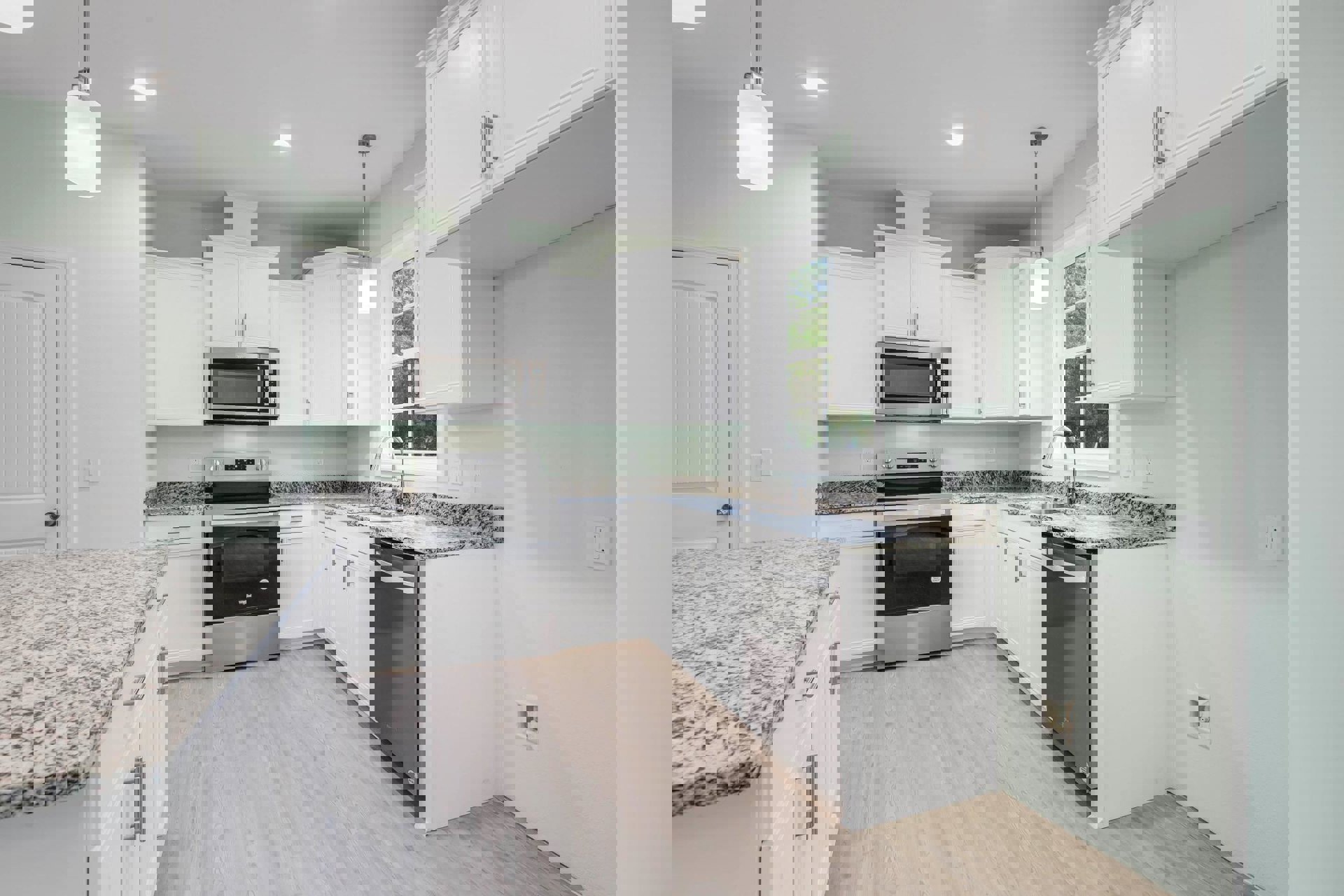 White kitchen with granite countertops, stainless steel stove, built-in microwave, white cabinetry, and wall outlet.