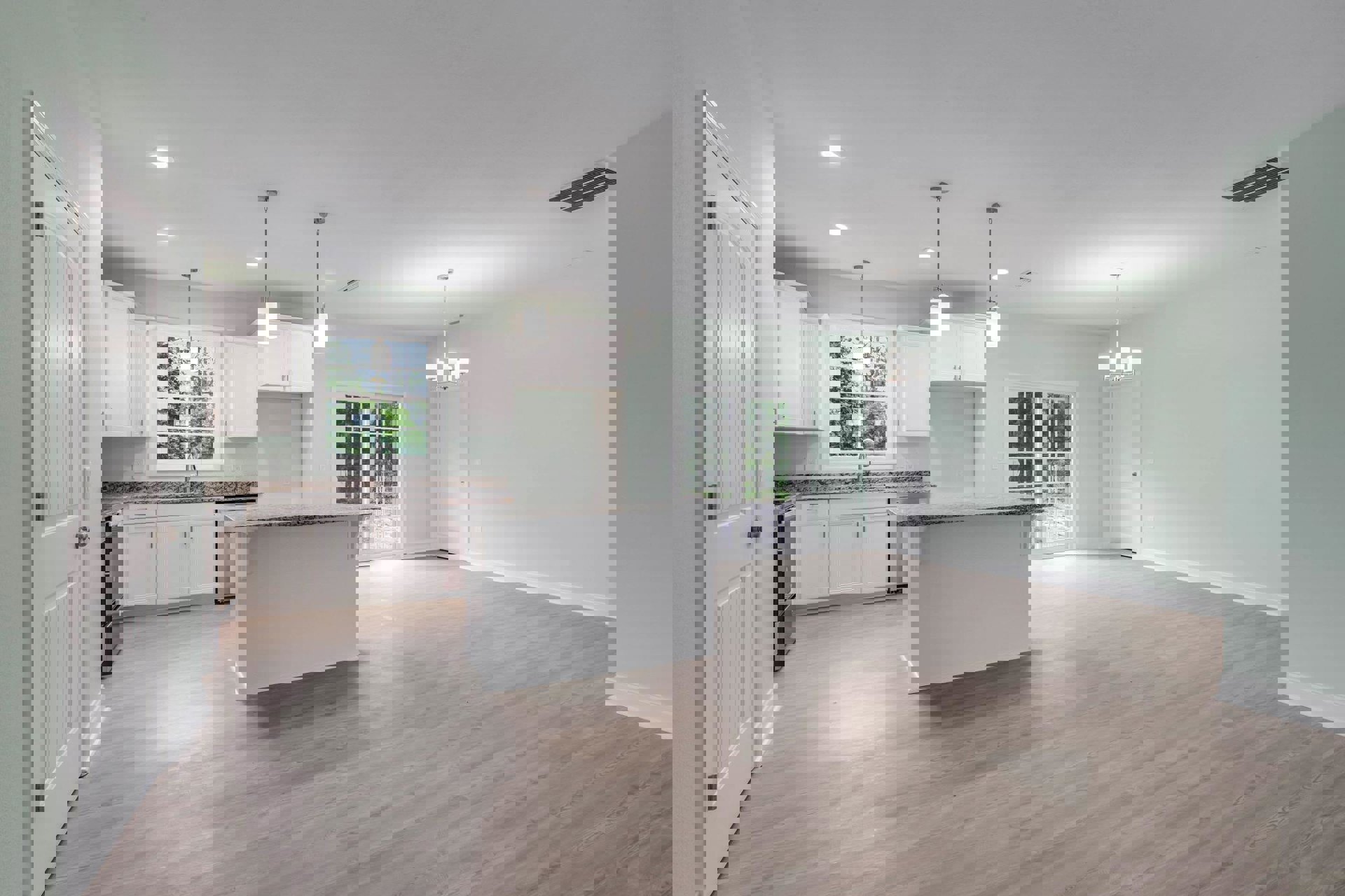 Kitchen with marble countertops, wood flooring, white cabinetry, glass-paneled door, and ceiling light above stainless steel sink