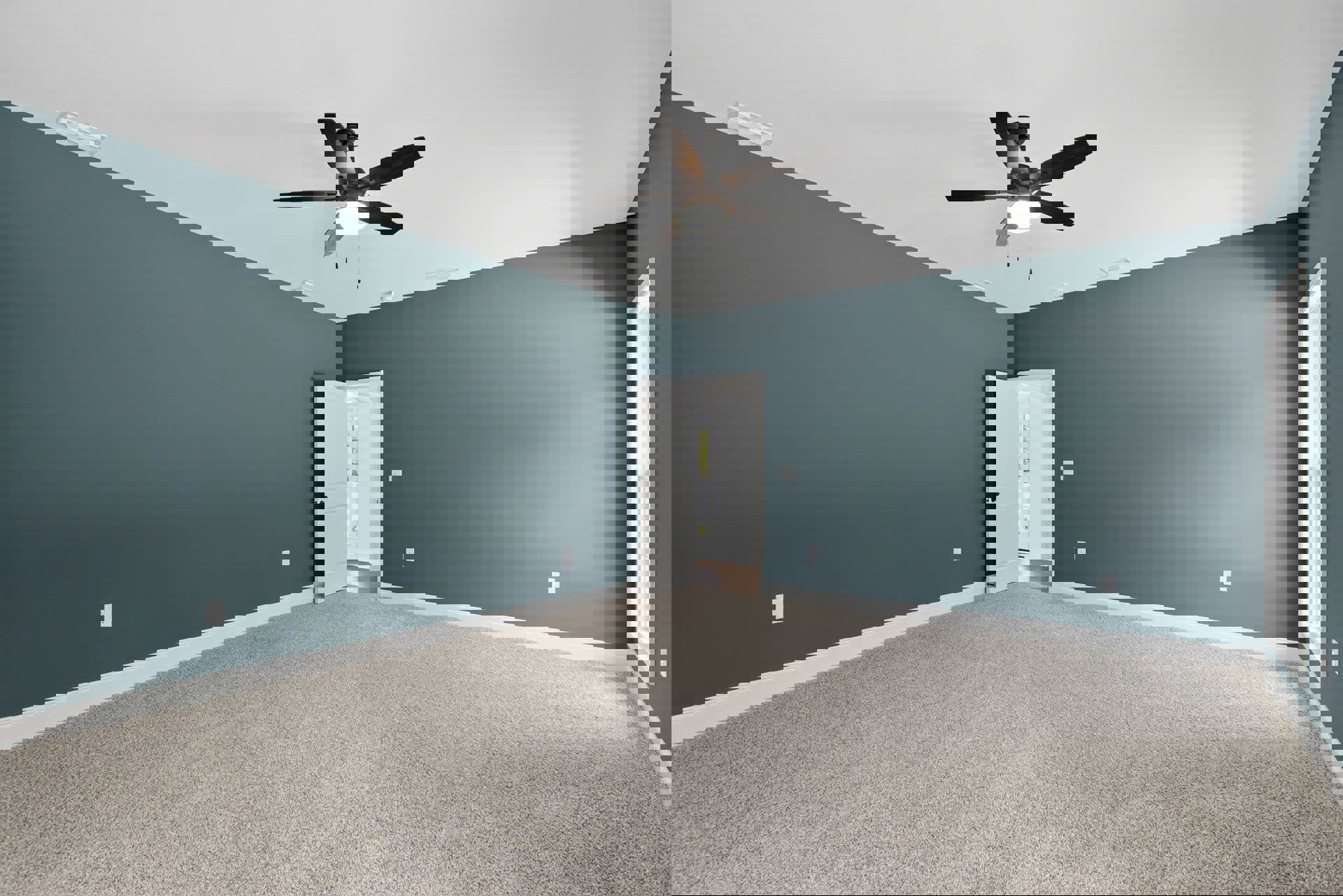 Carpeted room with blue accent wall, white paneled door with window, ceiling fan with light fixture, white trim and baseboards