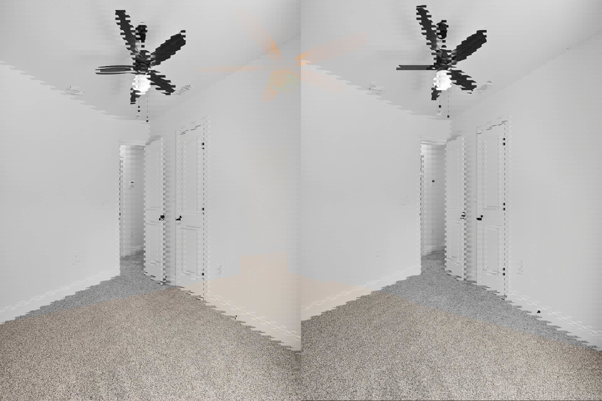Carpeted room with white walls, ceiling fan with light, and two white doors featuring black hardware