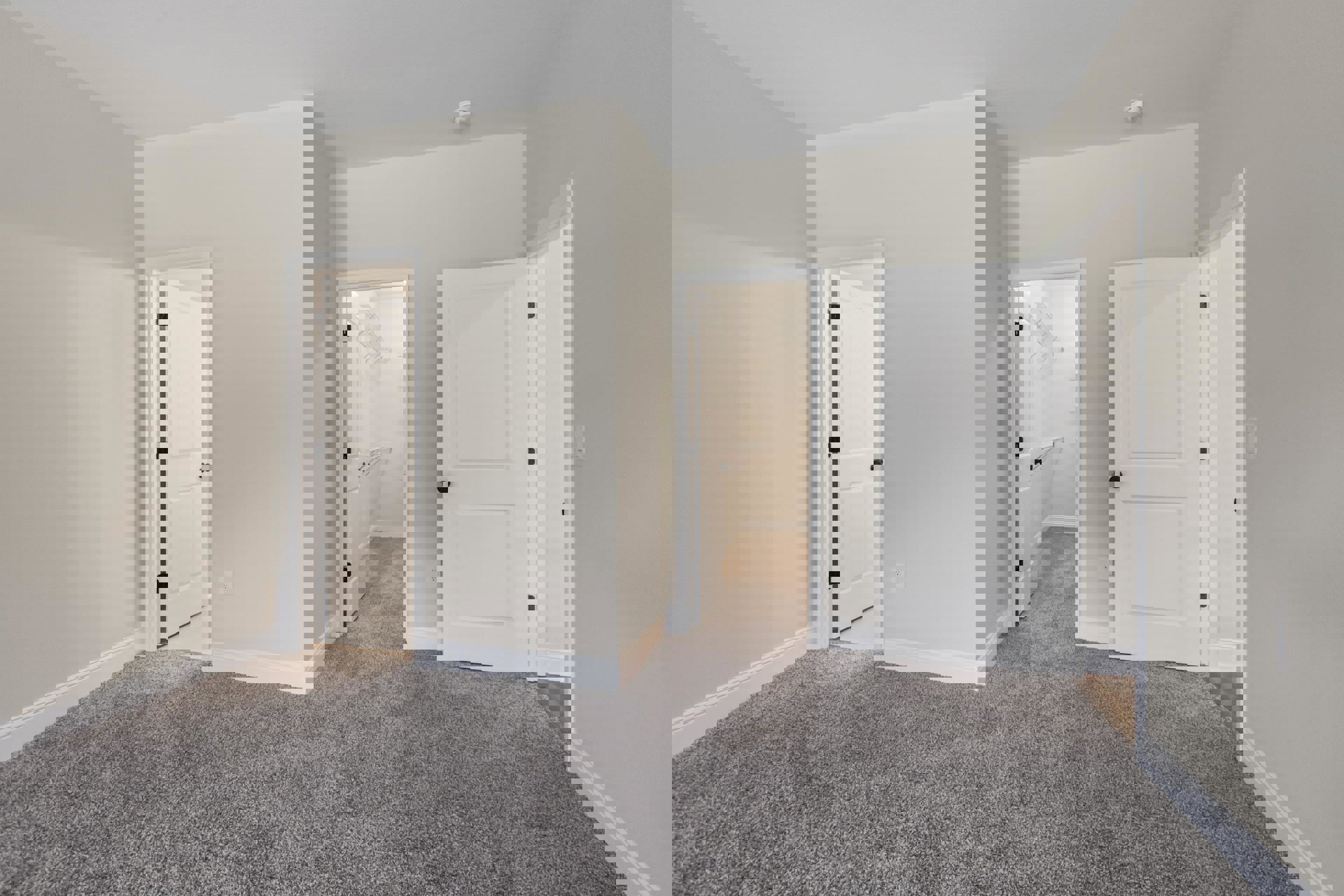 White-walled room with white doors, black door knobs, white closet door, light carpet flooring, and white ceiling