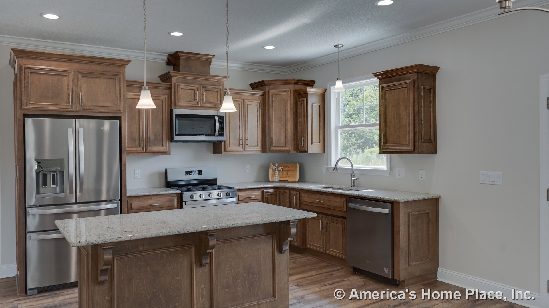 Custom kitchen with wood cabinetry, granite island and countertops, stainless refrigerator, range, microwave, and dishwasher; pendant lighting above island, double window over